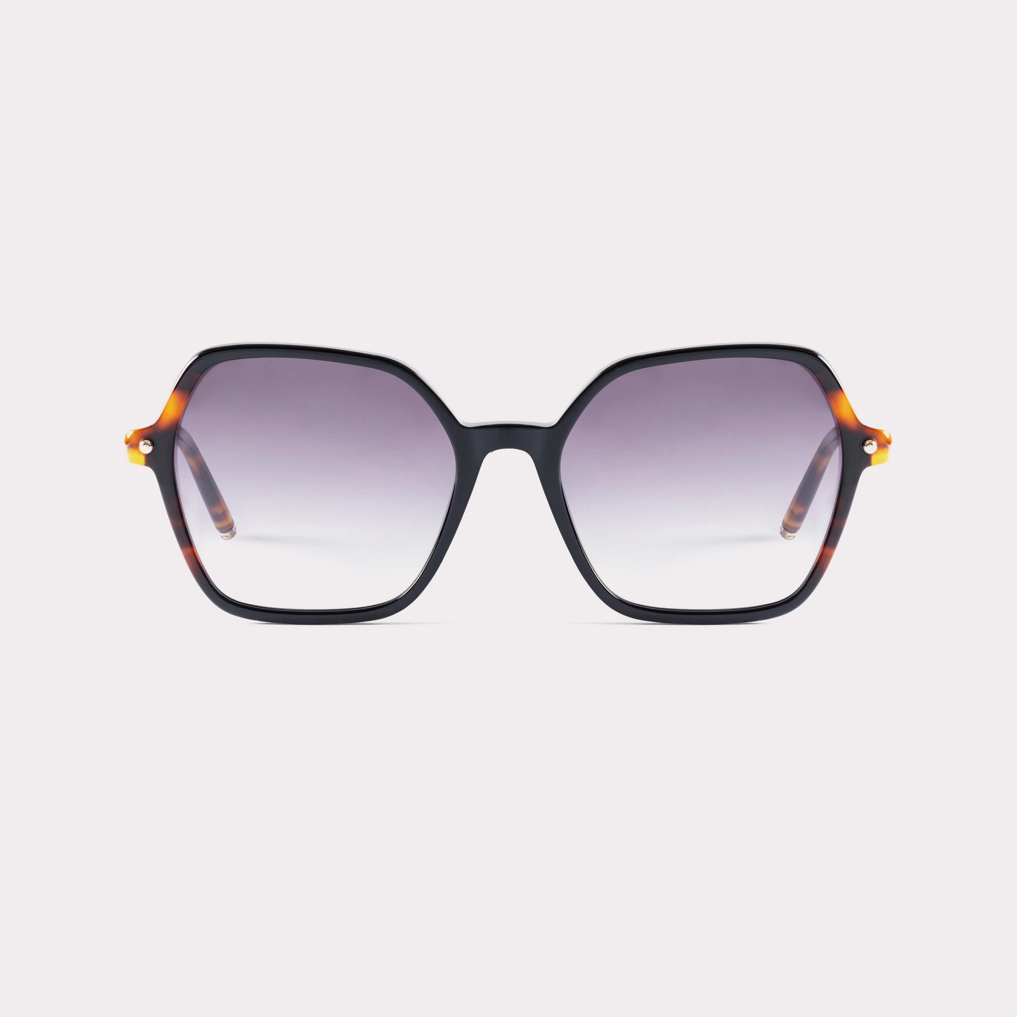 A pair of Peach Tortoise Sunglasses seen from the front