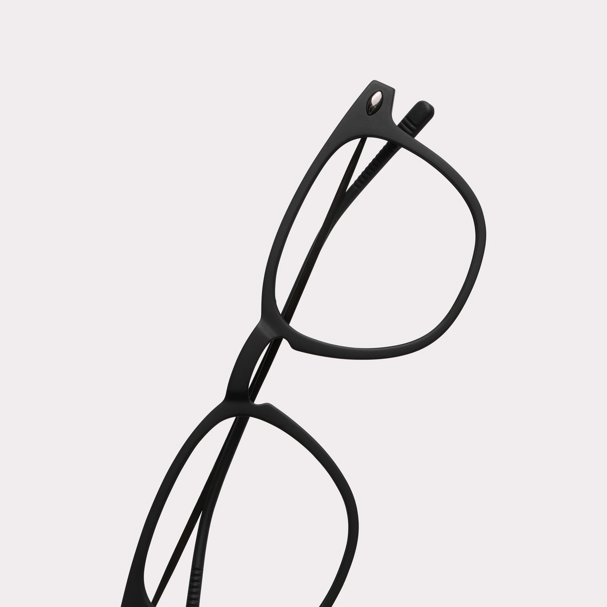 A pair of Doni Black Reading glasses in a macro view