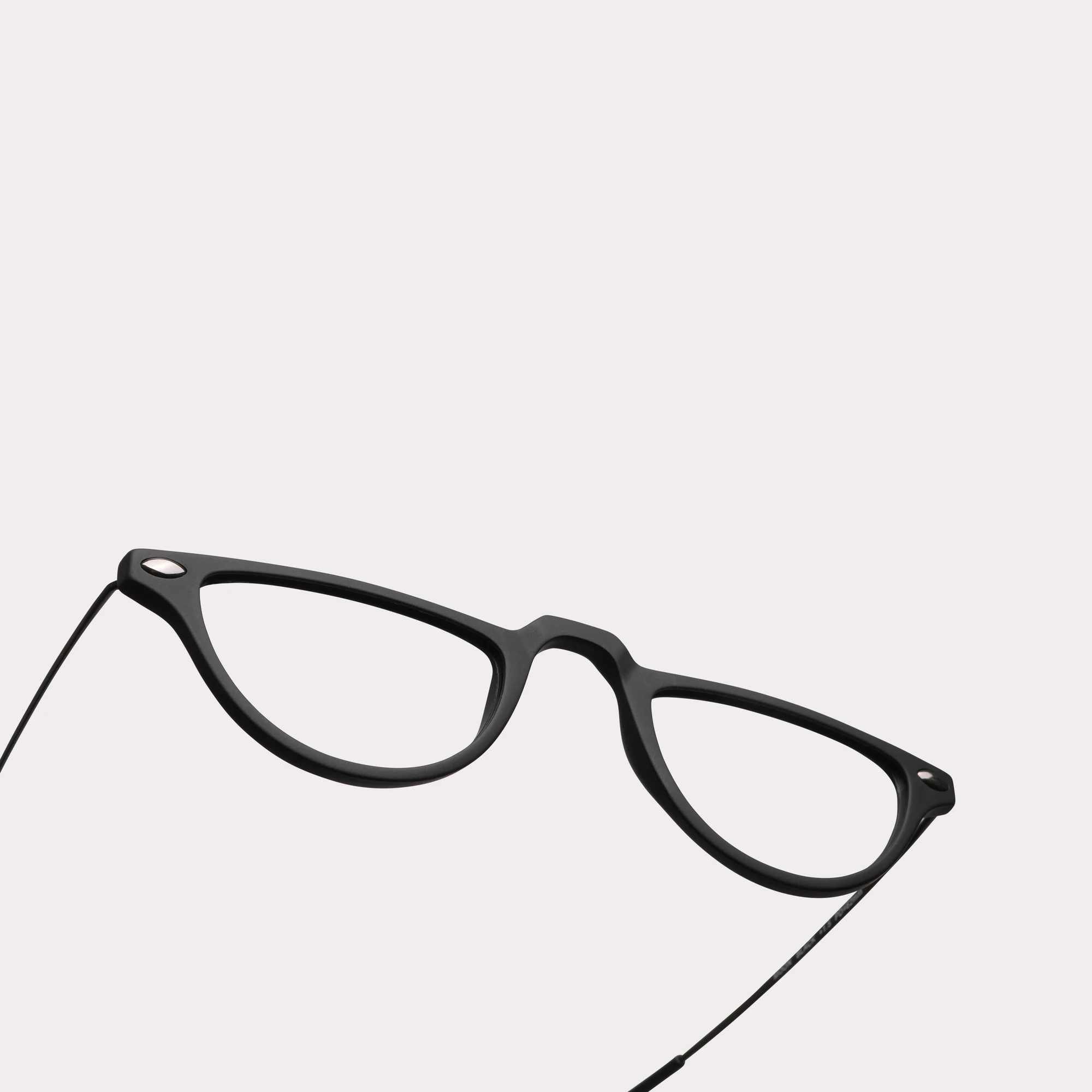 A pair of Moon Black Reading glasses in a macro view