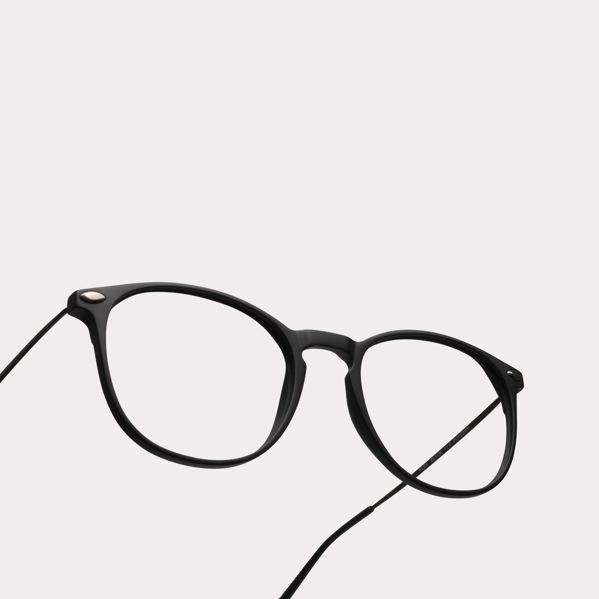 A pair of Alba Black Multi-distance reading glasses in a macro view