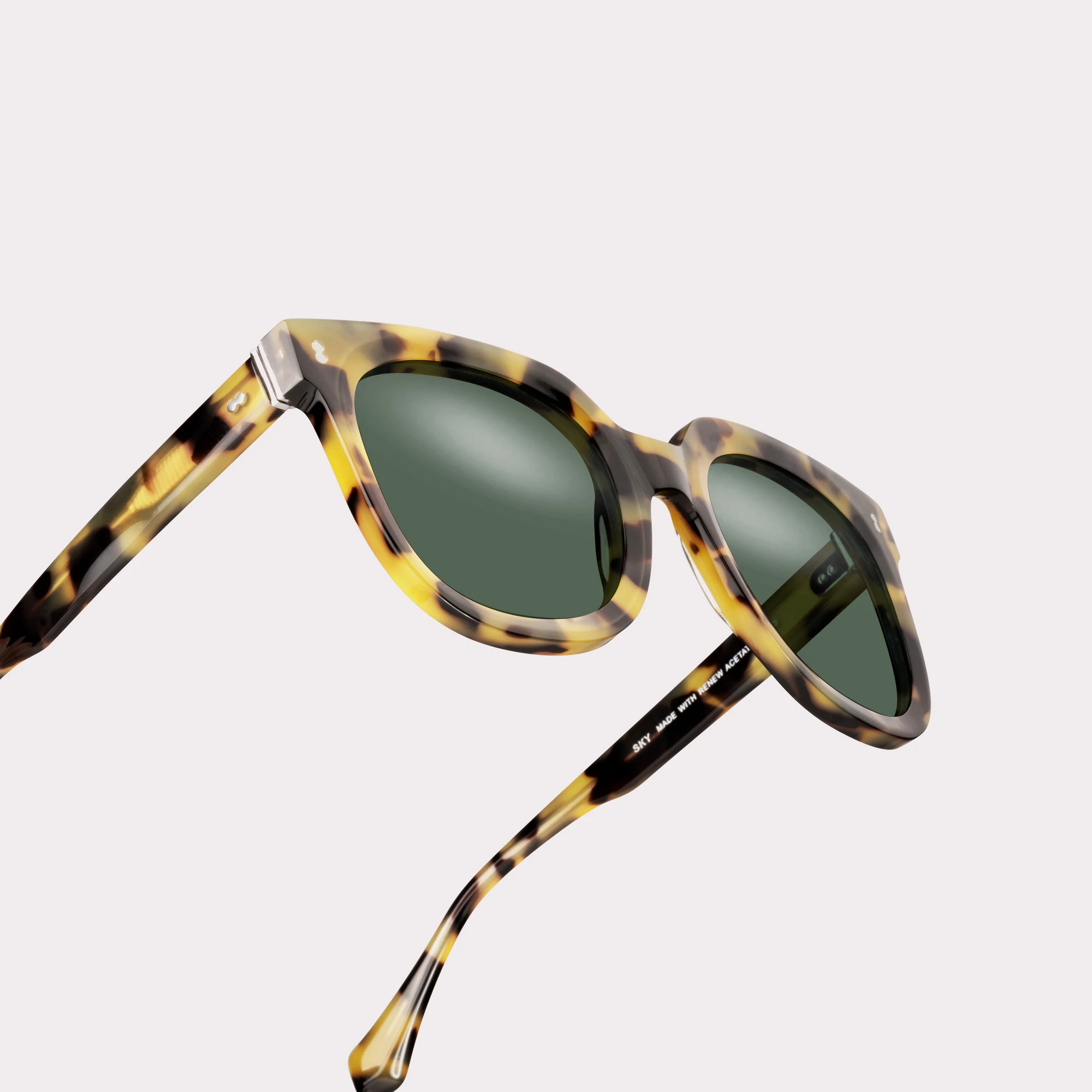 A pair of Sky Brown tortoise Sunglasses in a macro view