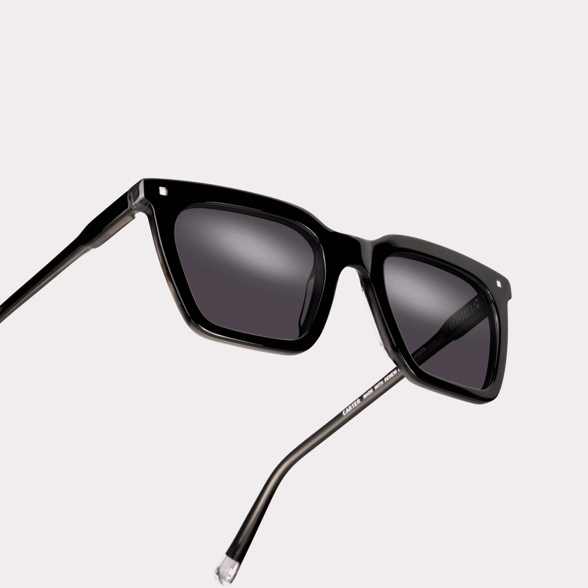 A pair of Carter Black Sunglasses in a macro view