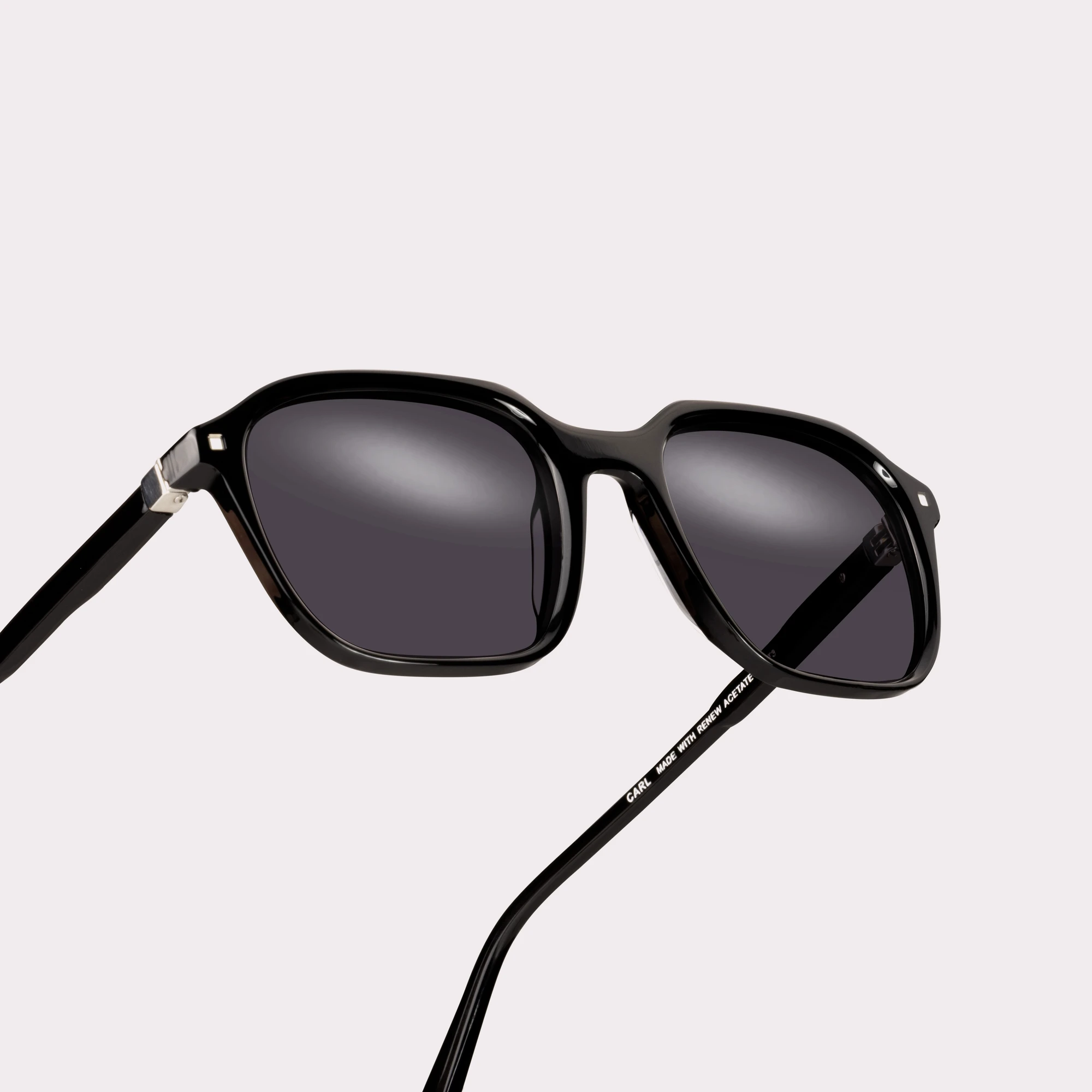 A pair of Carl Black Sunglasses in a macro view