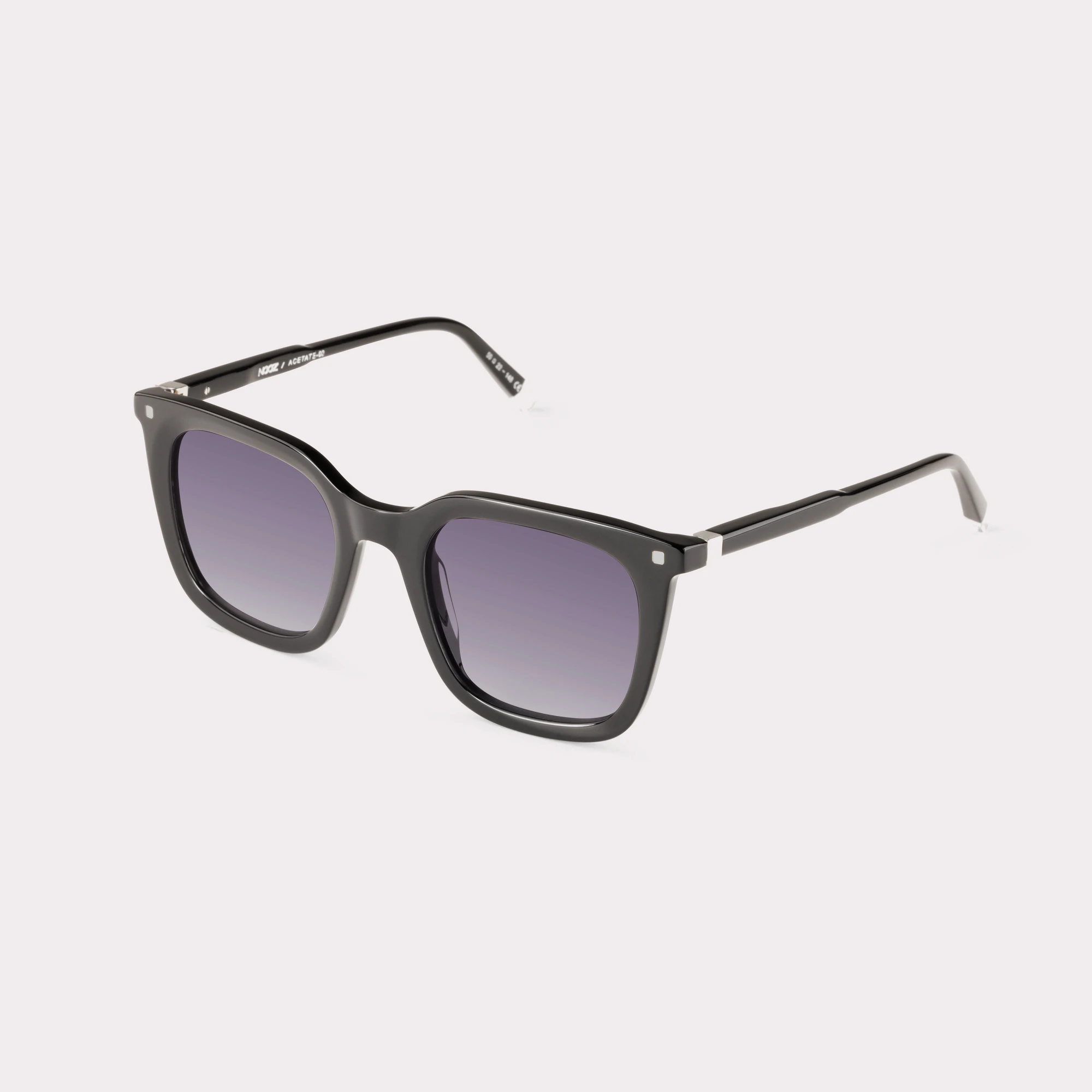 A pair of Candid Black Sunglasses  seen from the side