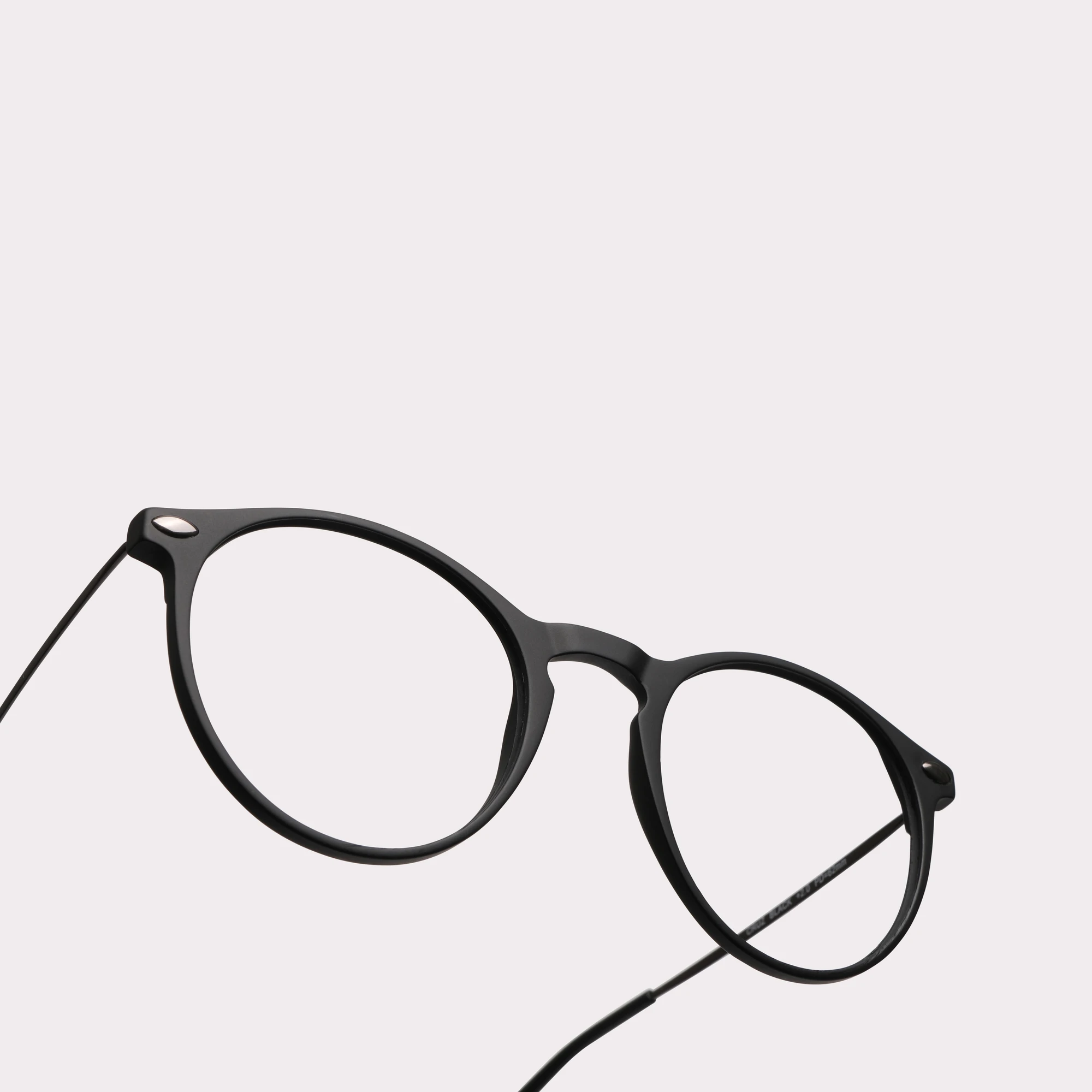 A pair of Cruz Black Reading glasses in a macro view