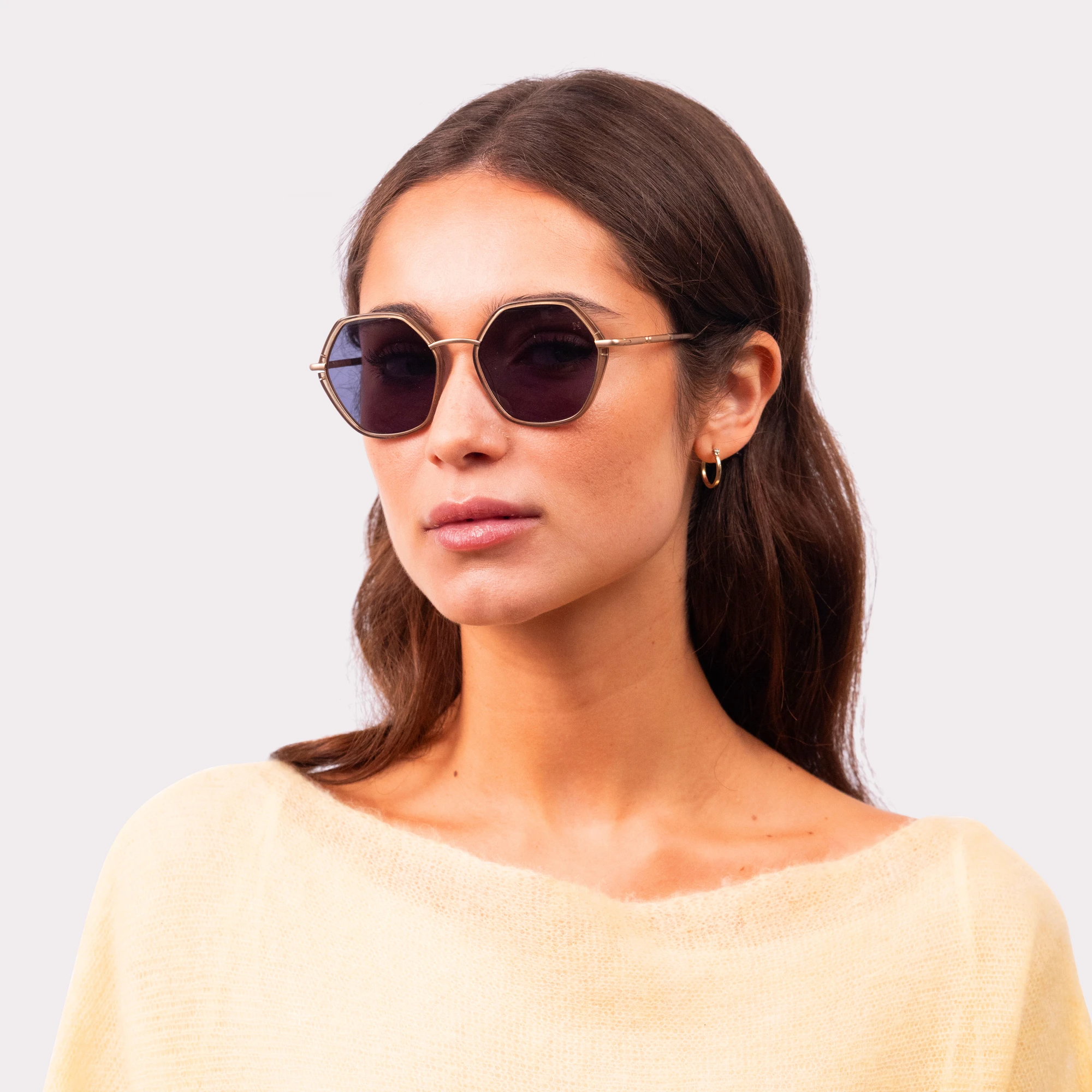 A pair of Pearl Olive Sunglasses