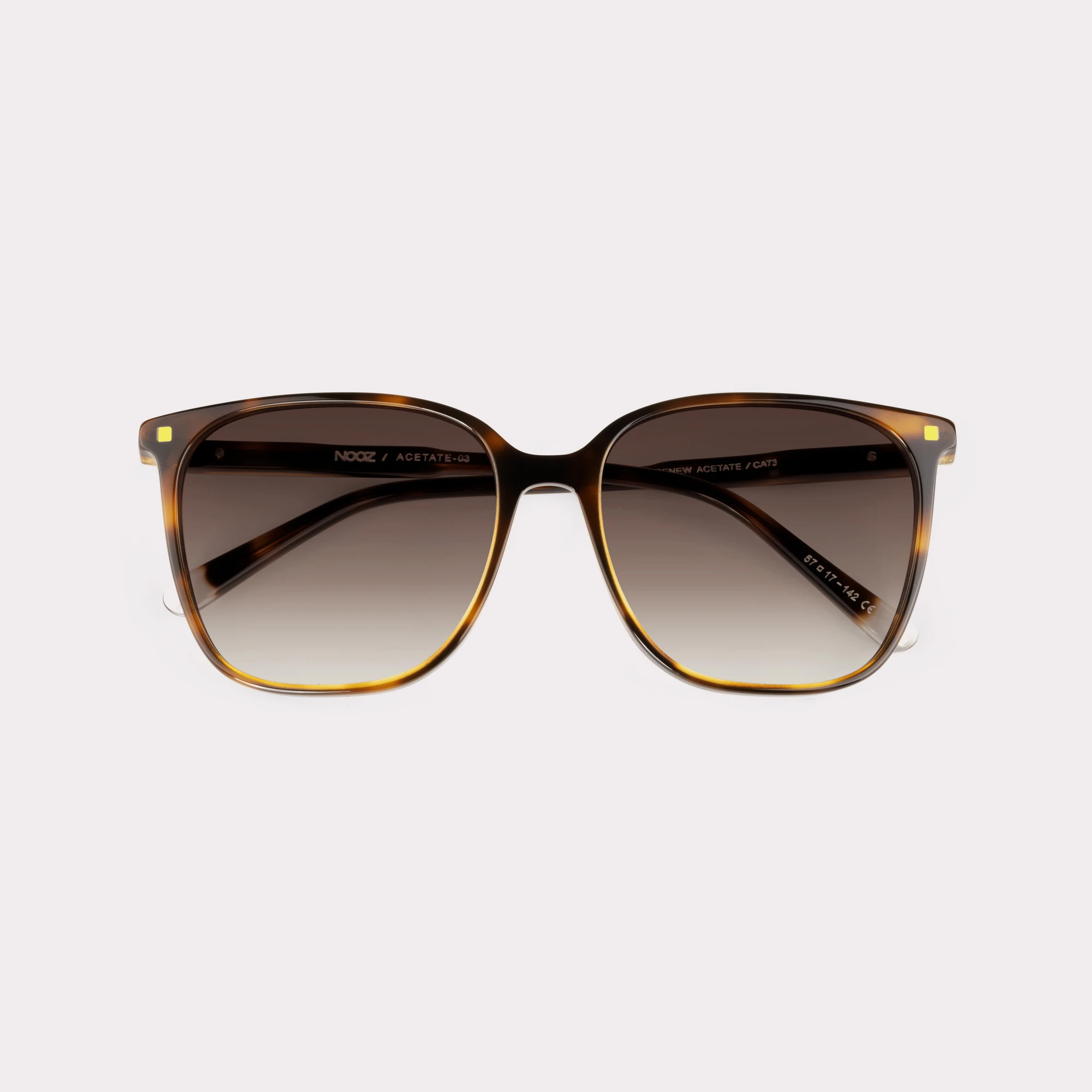A pair of Carla Tortoise Sunglasses folded