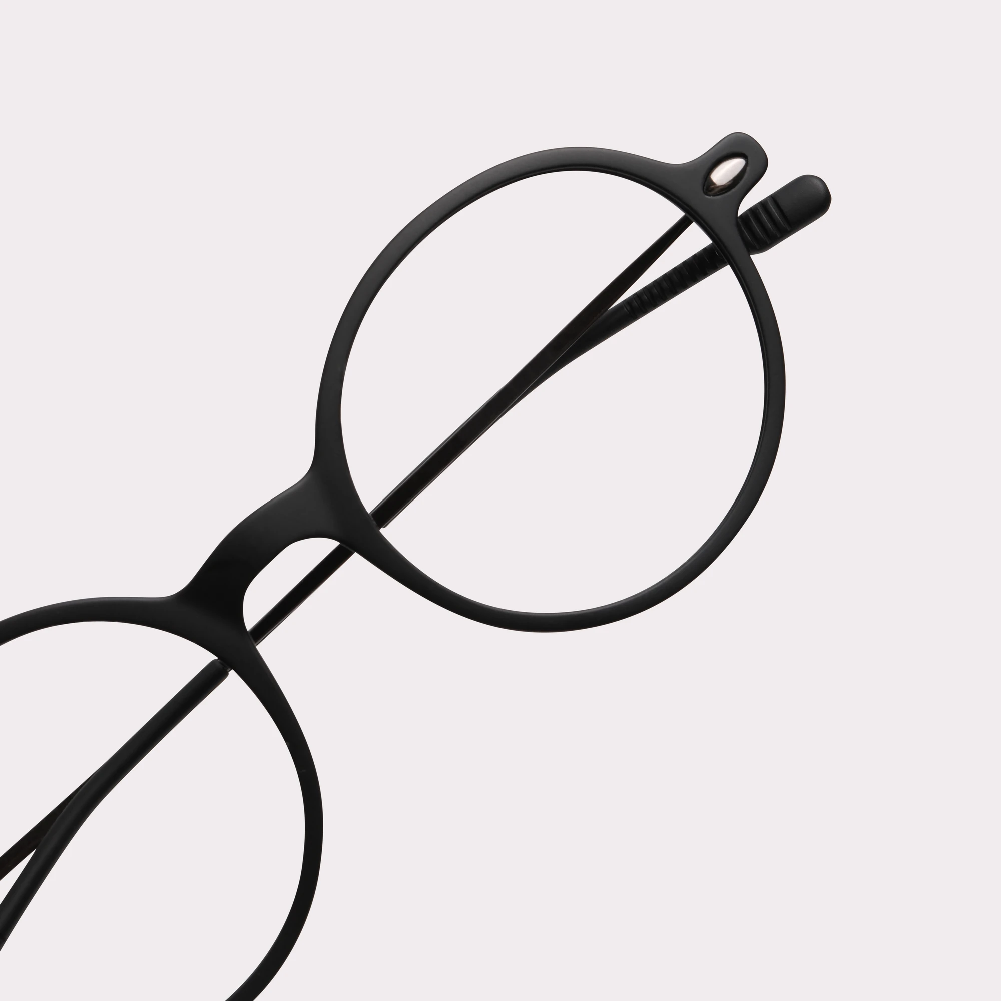 A pair of Milo Black Reading glasses in a macro view