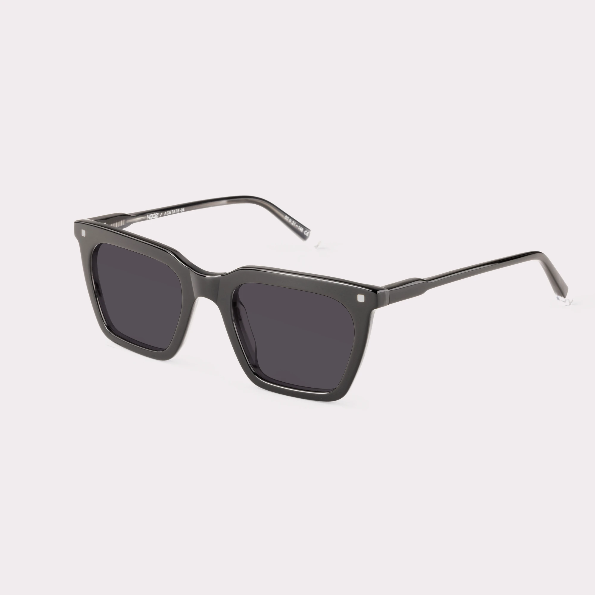 A pair of Carter Black Sunglasses  seen from the side