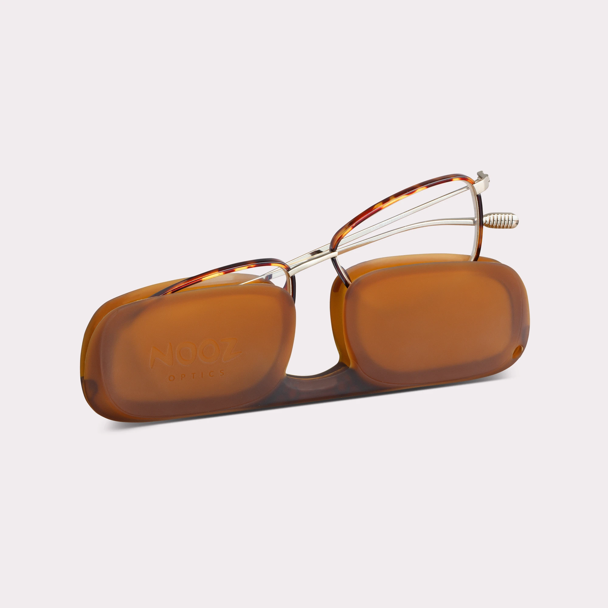 A pair of Faro Tortoise Reading glasses coming out of its case