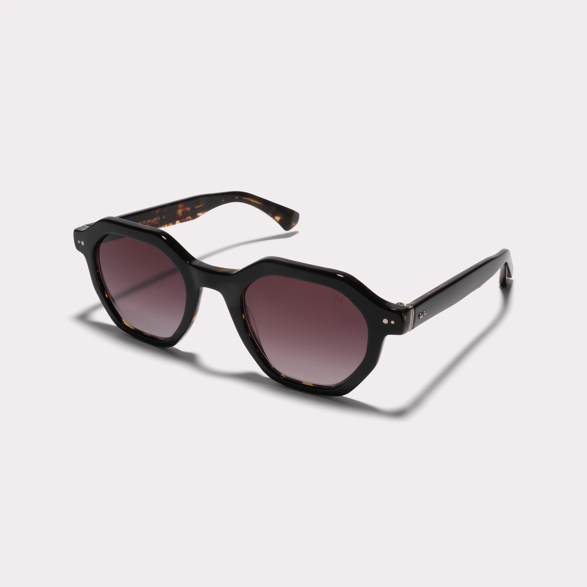 A pair of Milton Black Sunglasses  seen from the side