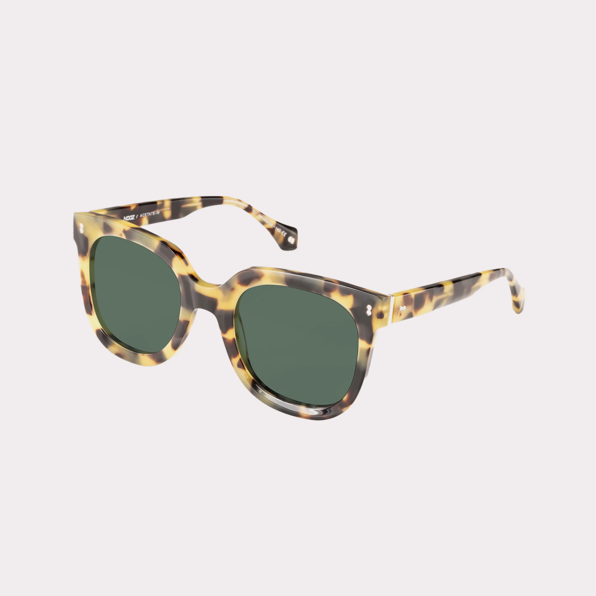 A pair of Sky Brown tortoise Sunglasses  seen from the side