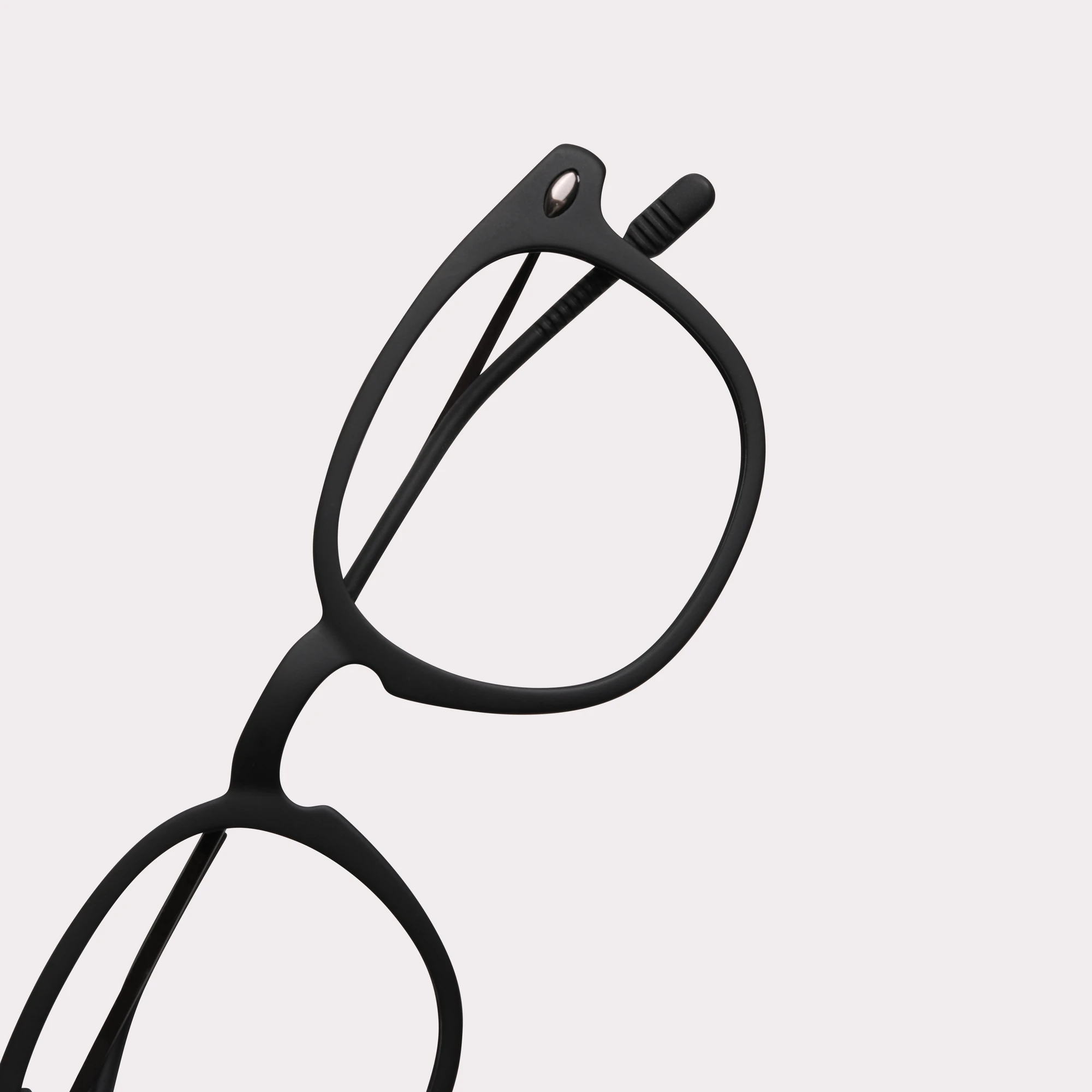 A pair of Alma Black Reading glasses in a macro view