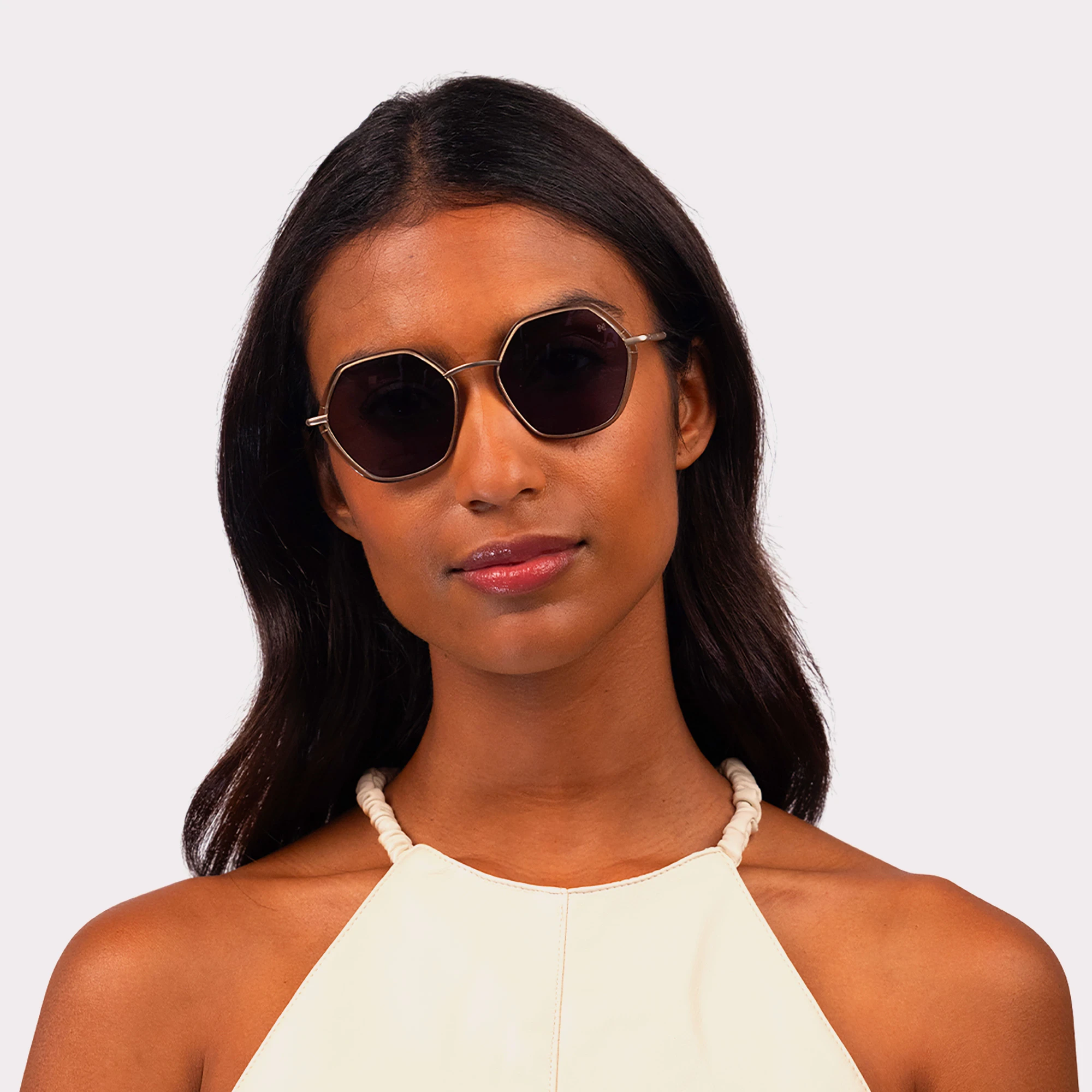 A pair of Pearl Olive Sunglasses