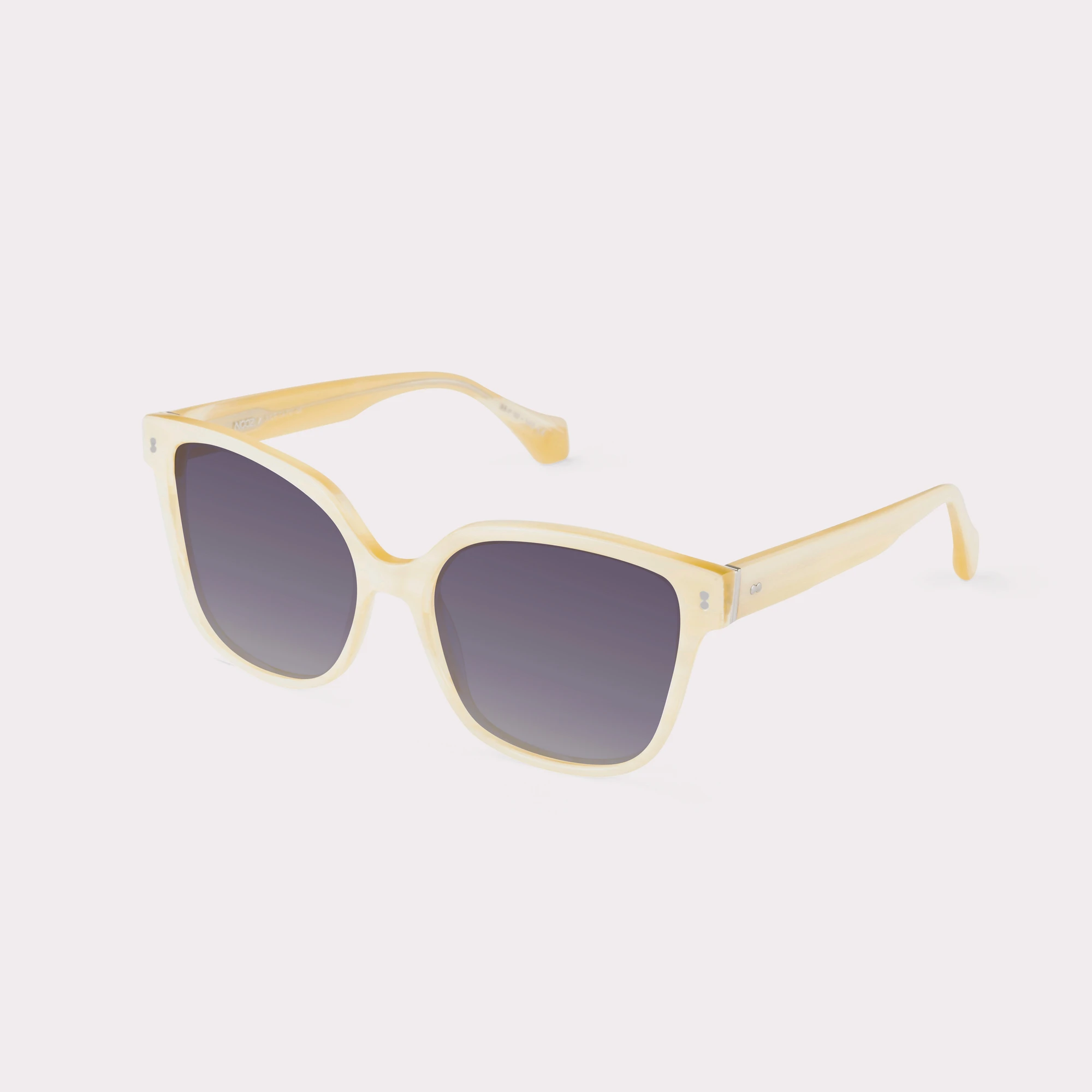 A pair of Lucky Milky Beige Sunglasses  seen from the side