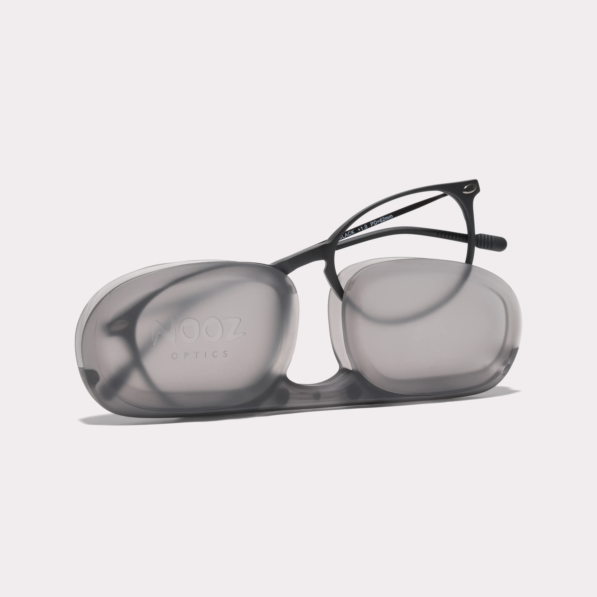 A pair of Alba Black Multi-distance reading glasses coming out of its case