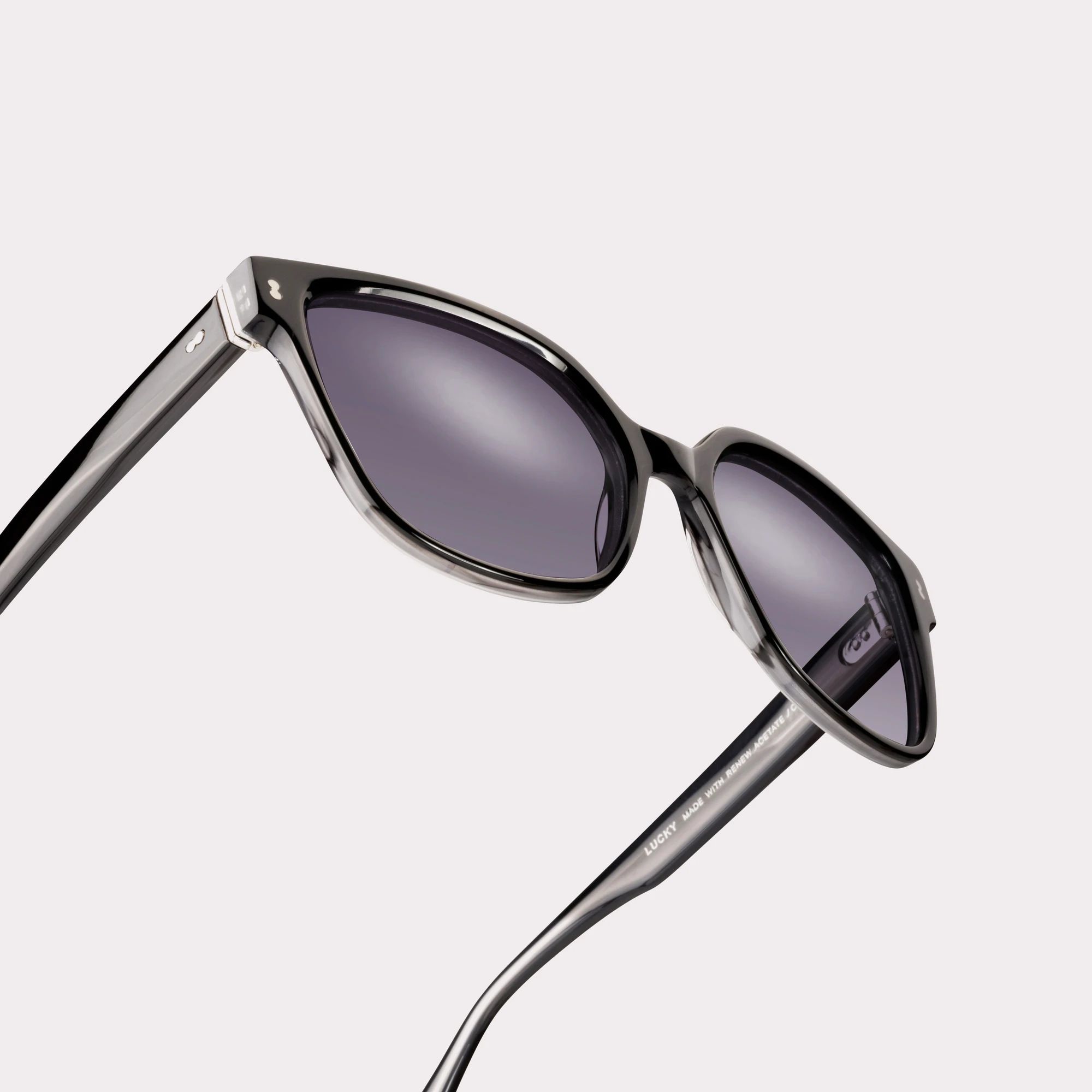 A pair of Lucky Black Sunglasses in a macro view
