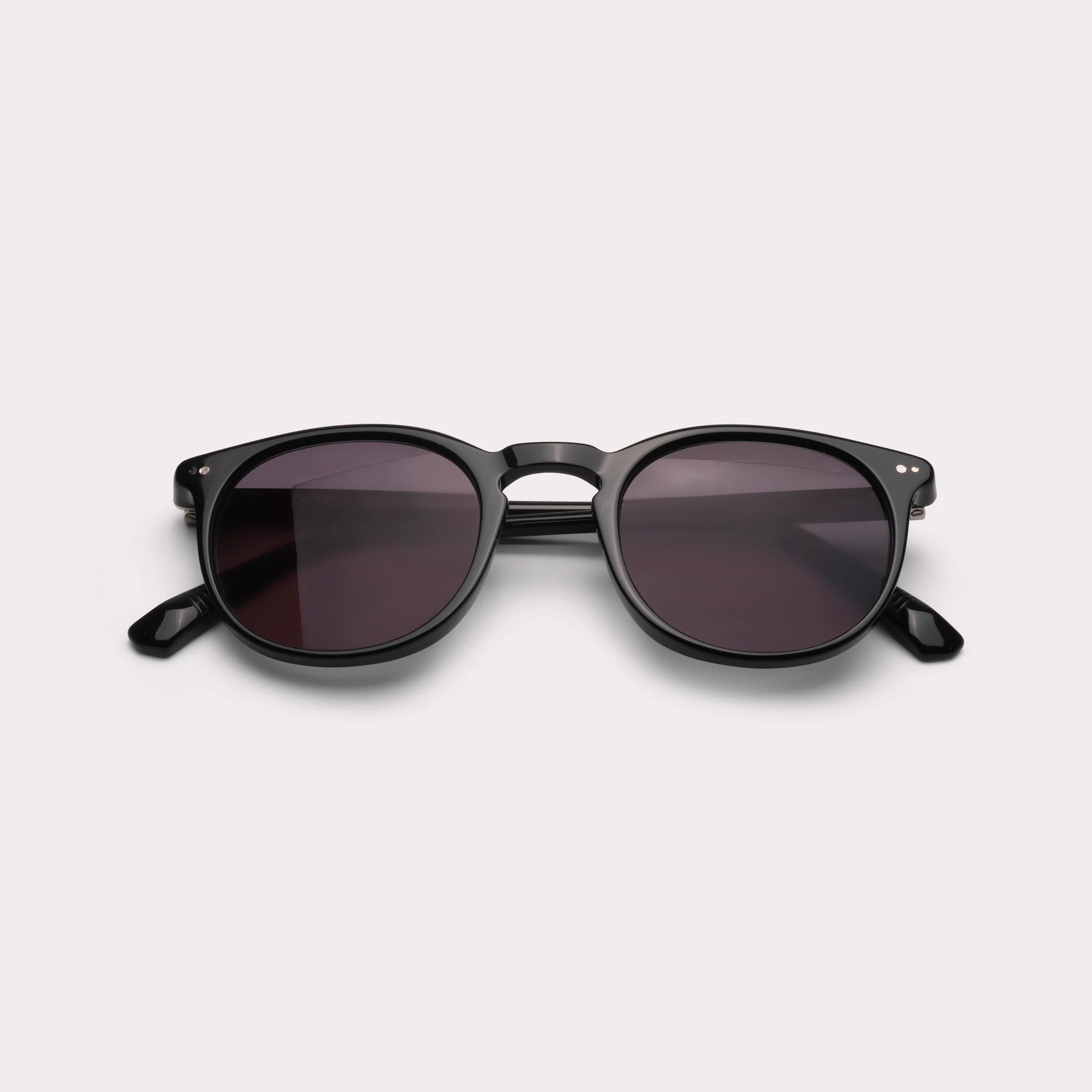 A pair of Basil Black Sunglasses folded