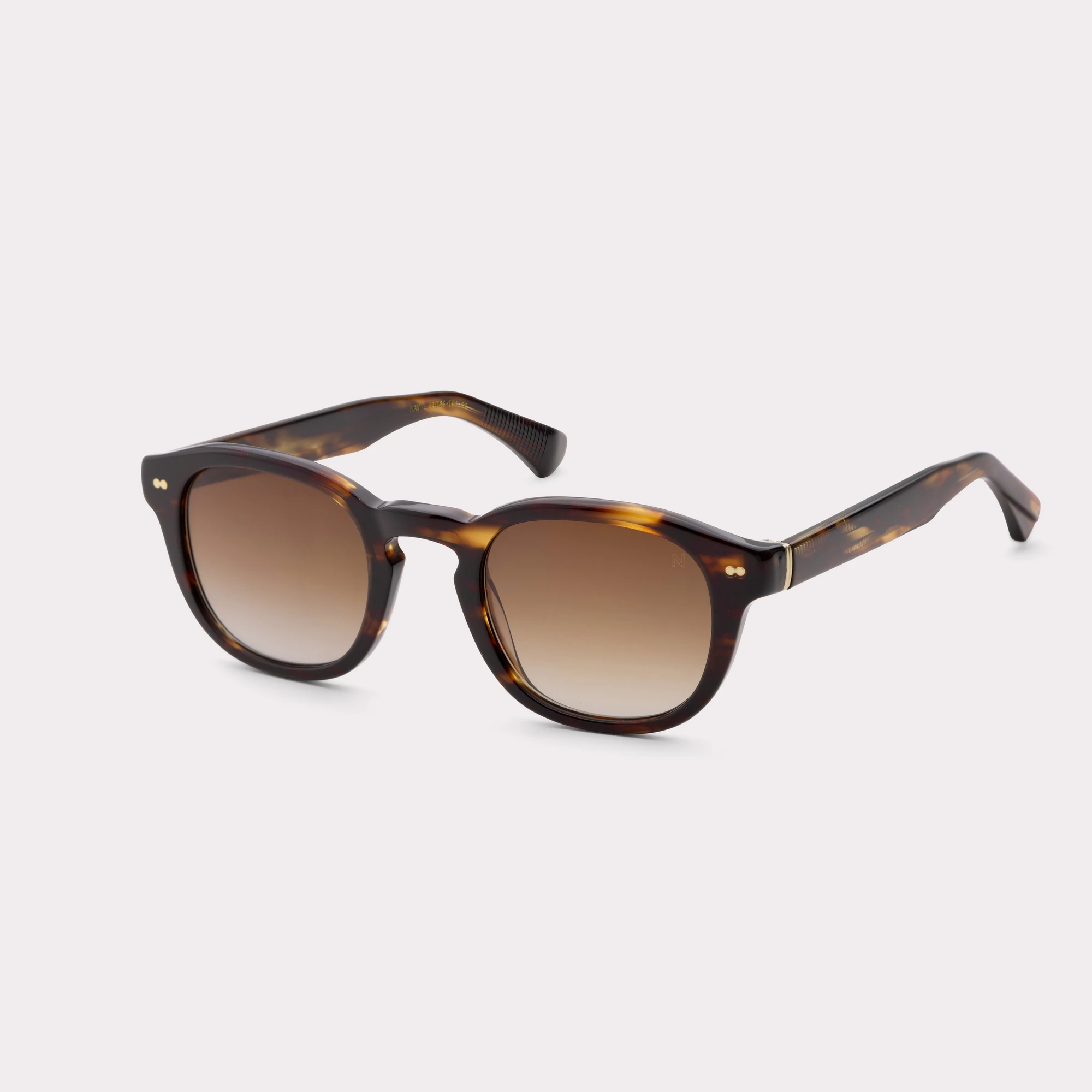 A pair of Owen Havana Sunglasses  seen from the side