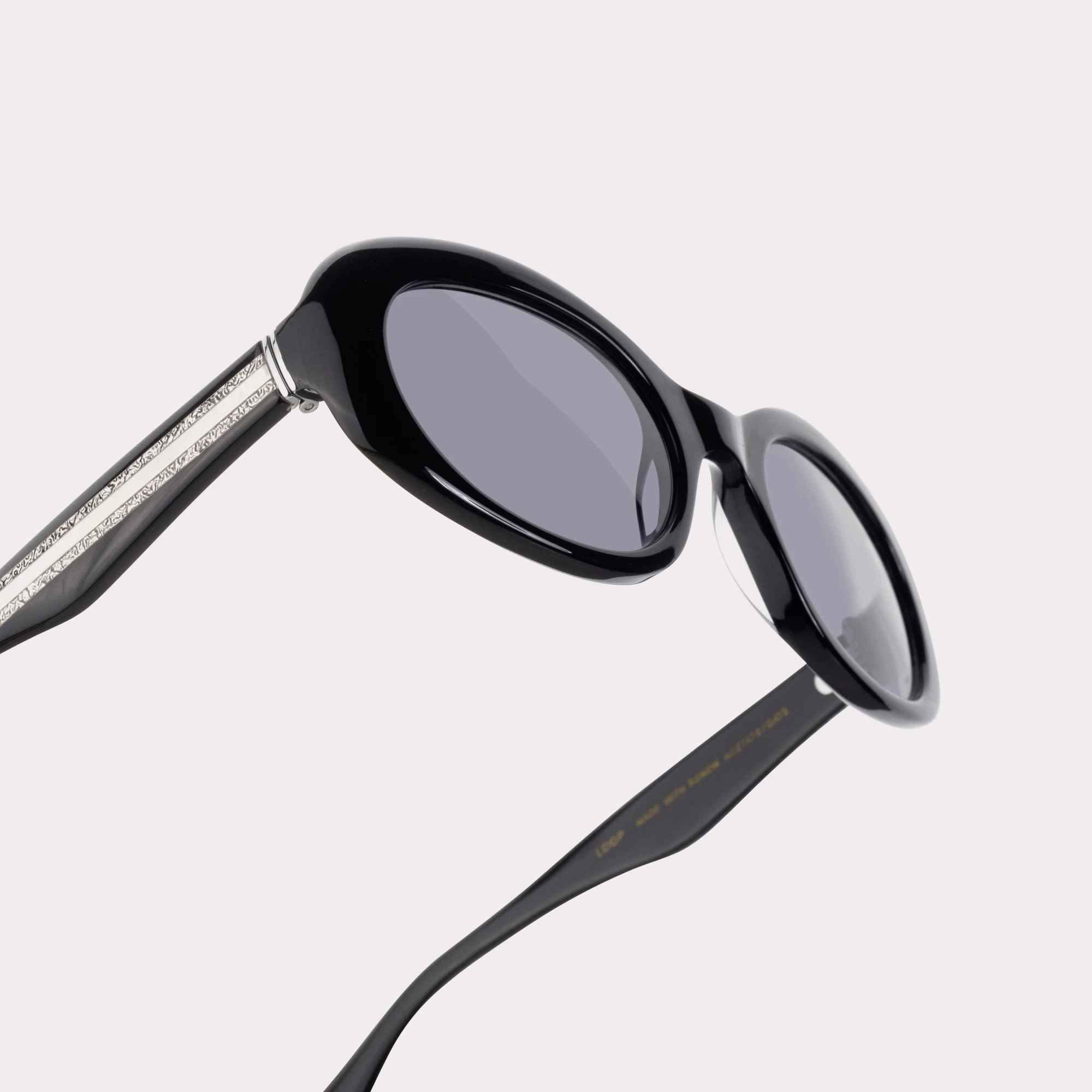 A pair of Loop Black Sunglasses in a macro view