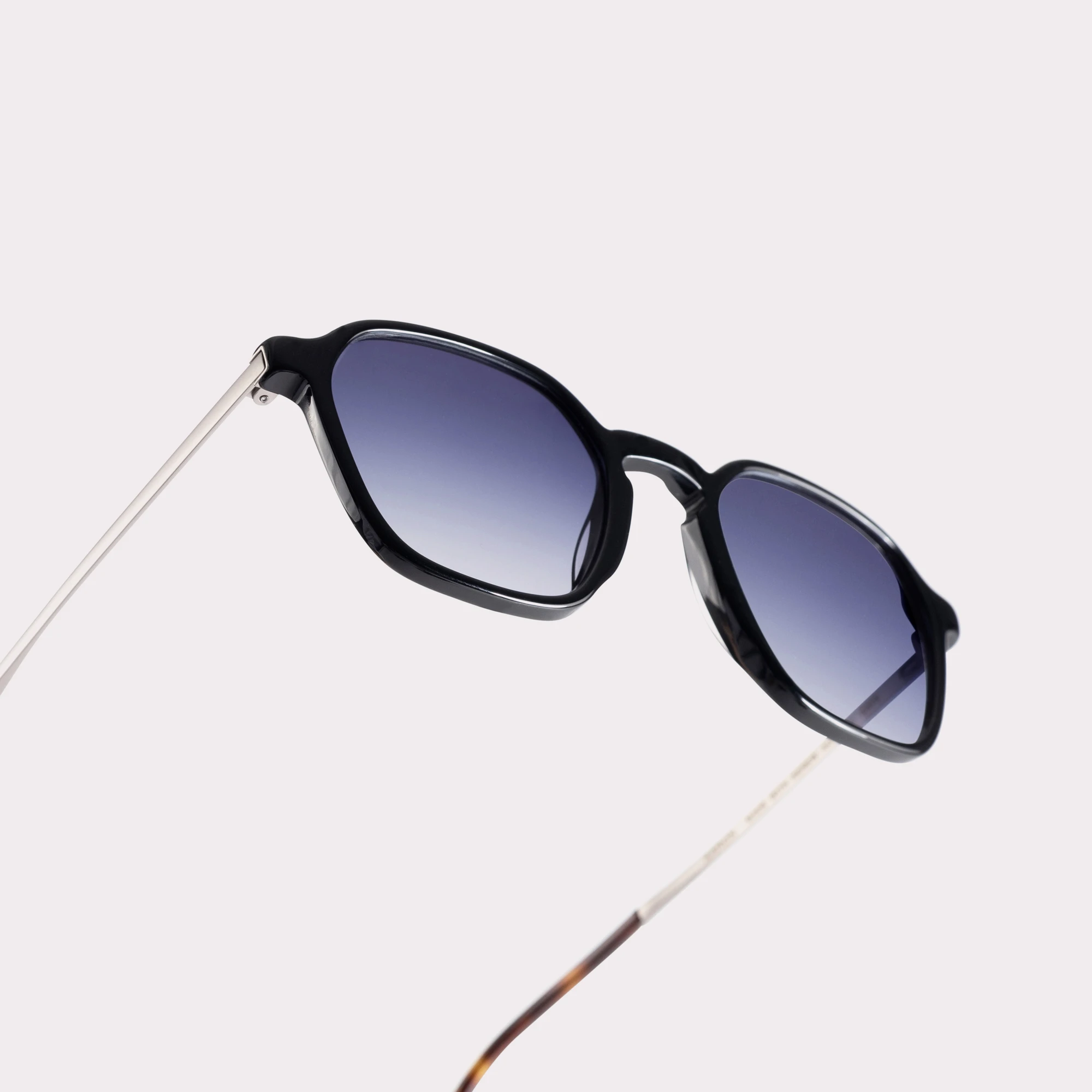 A pair of Aaron Black Sunglasses in a macro view