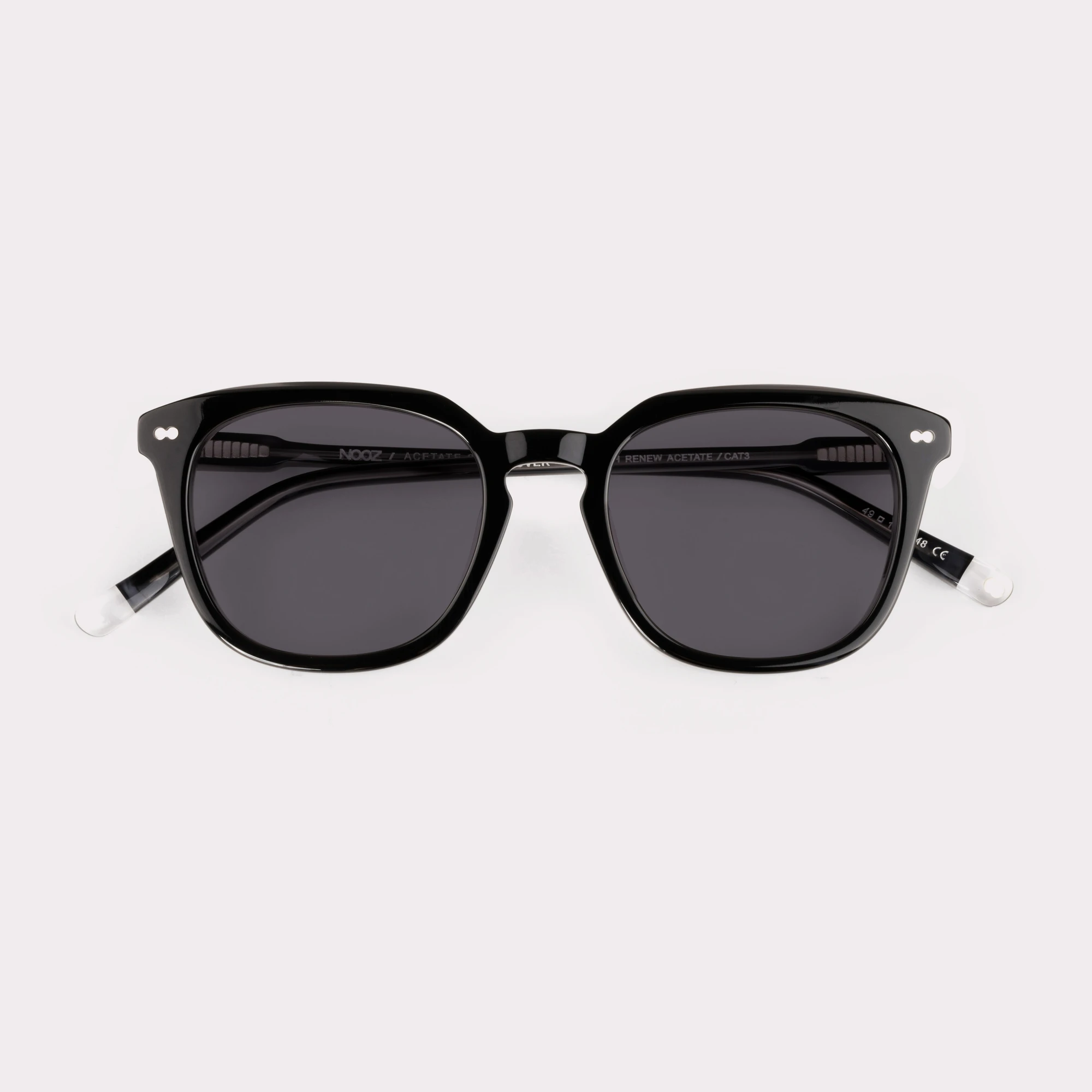 A pair of Clover Black Sunglasses folded