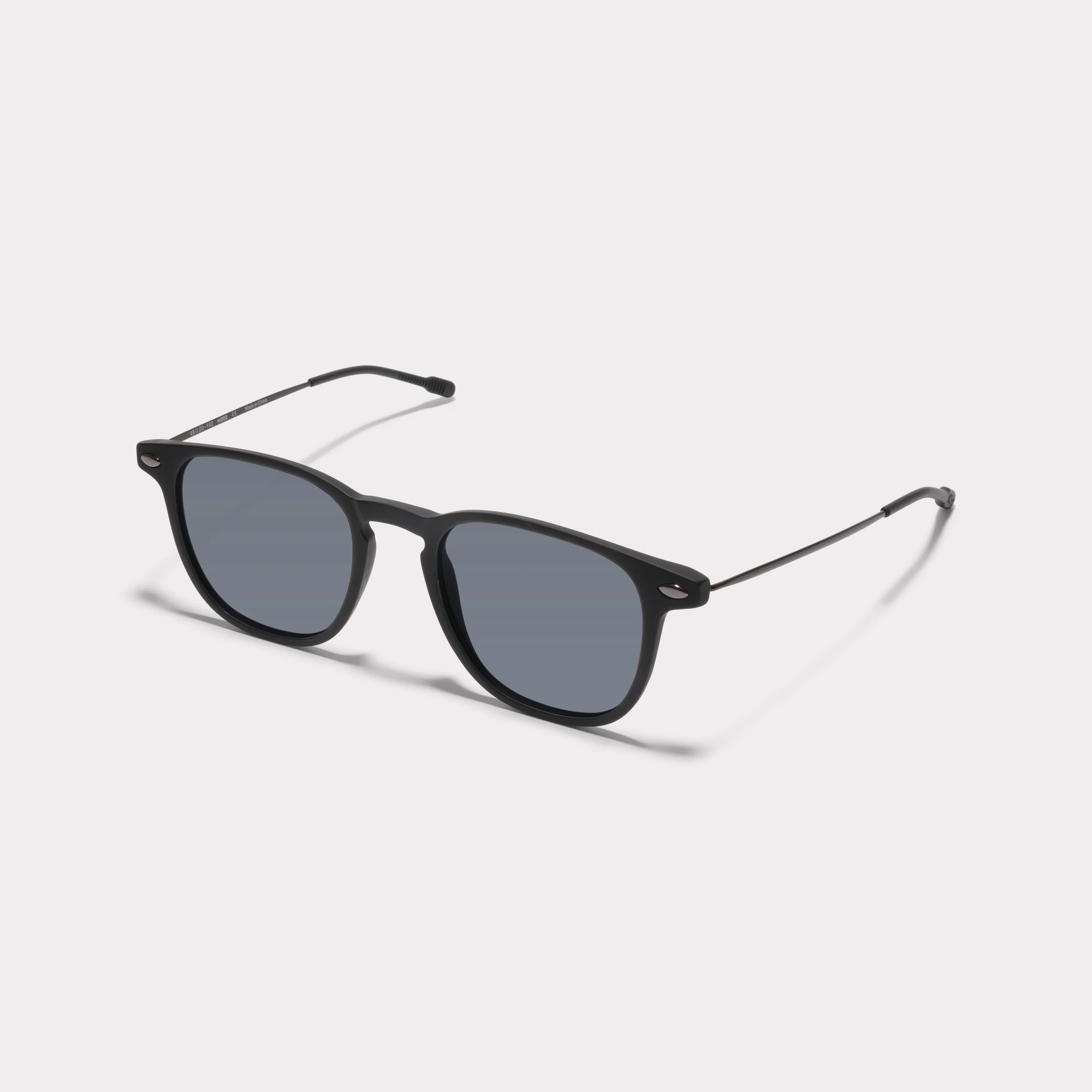 A pair of Doni Black Sunglasses  seen from the side