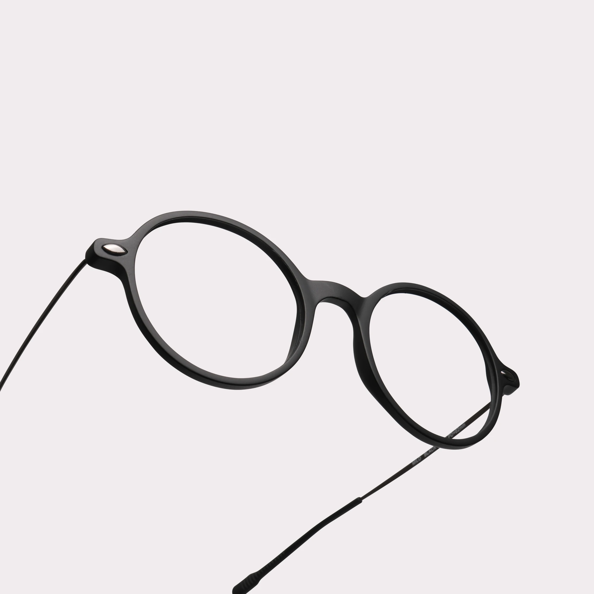 A pair of Milo Black Reading glasses in a macro view
