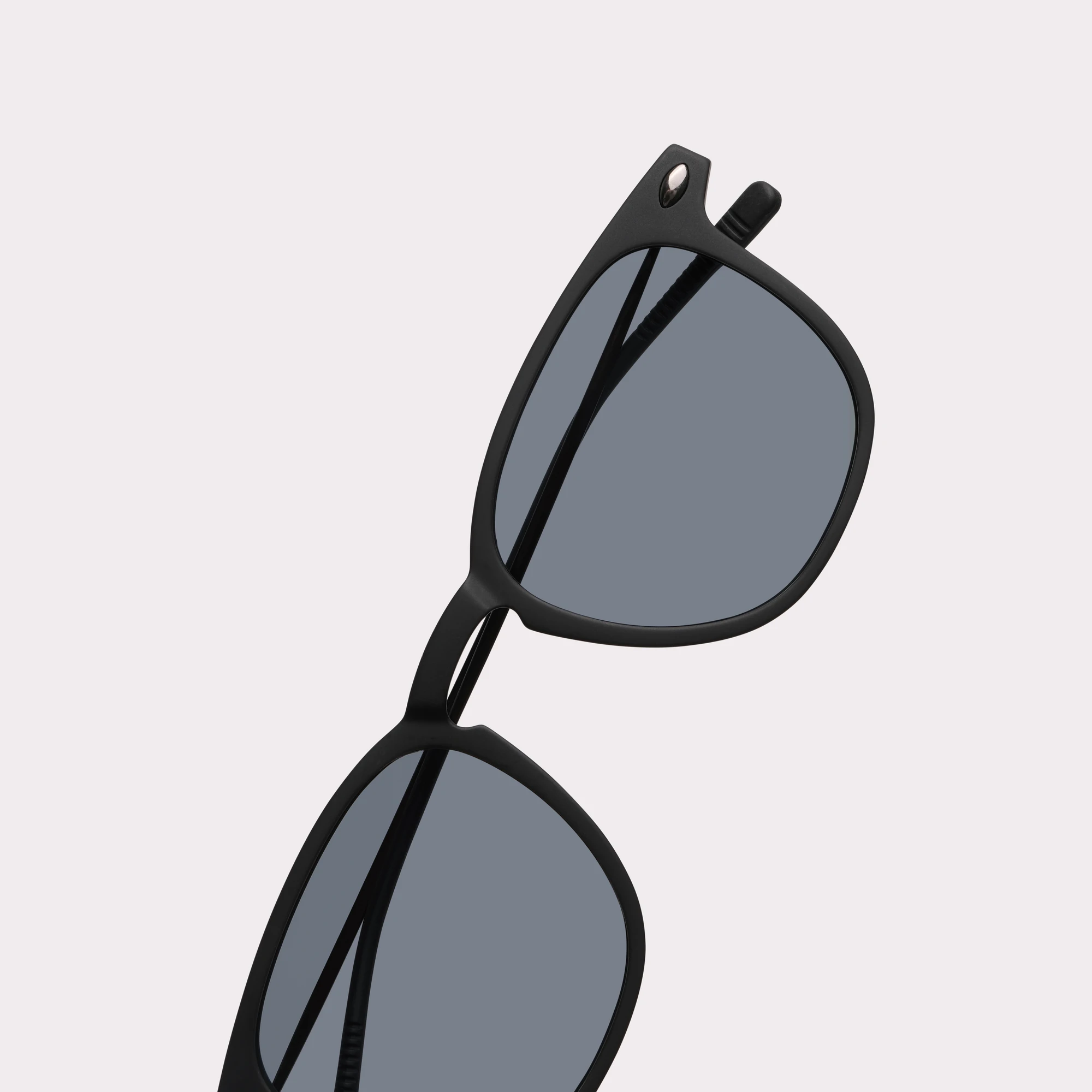 A pair of Doni Black Sunglasses in a macro view
