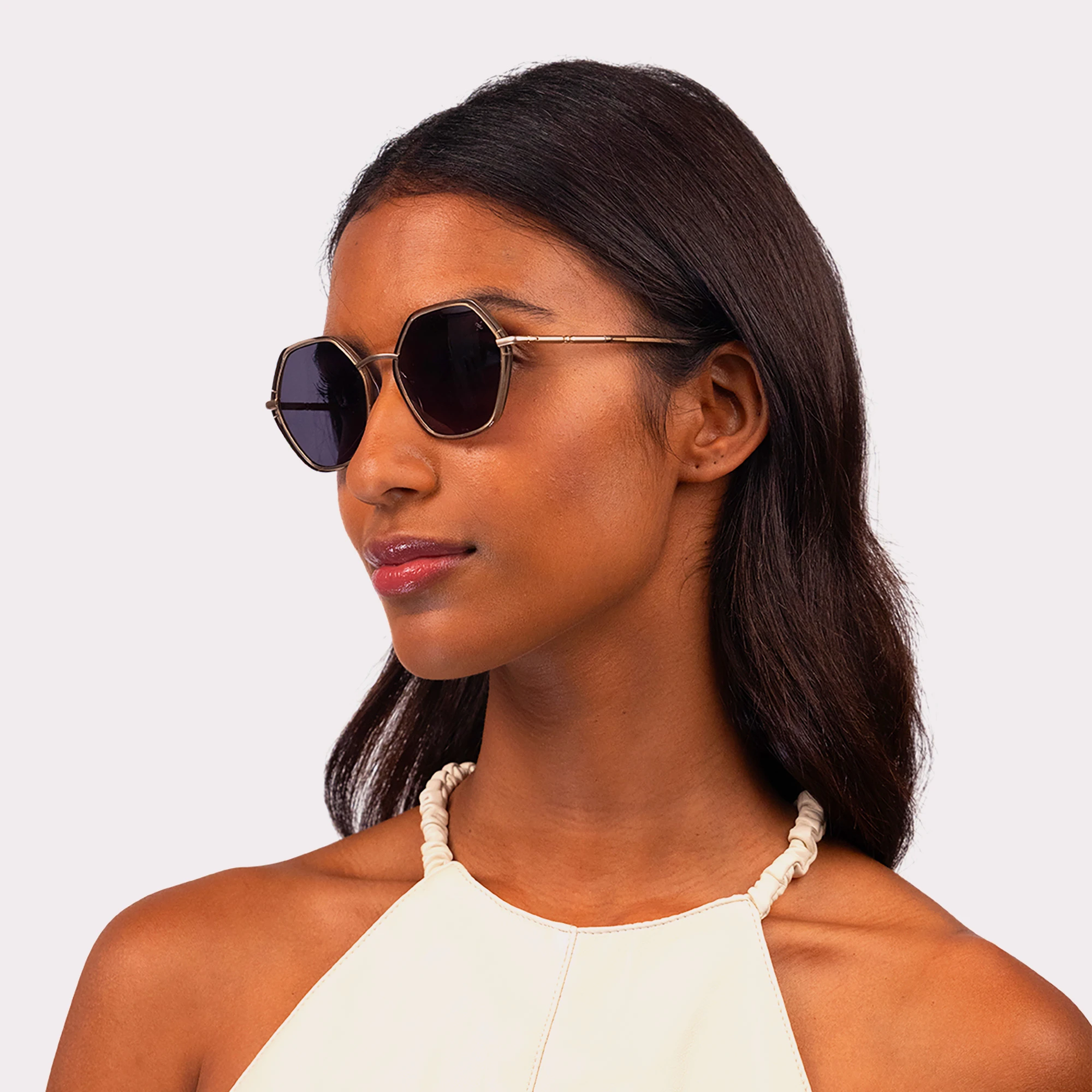 A pair of Pearl Olive Sunglasses