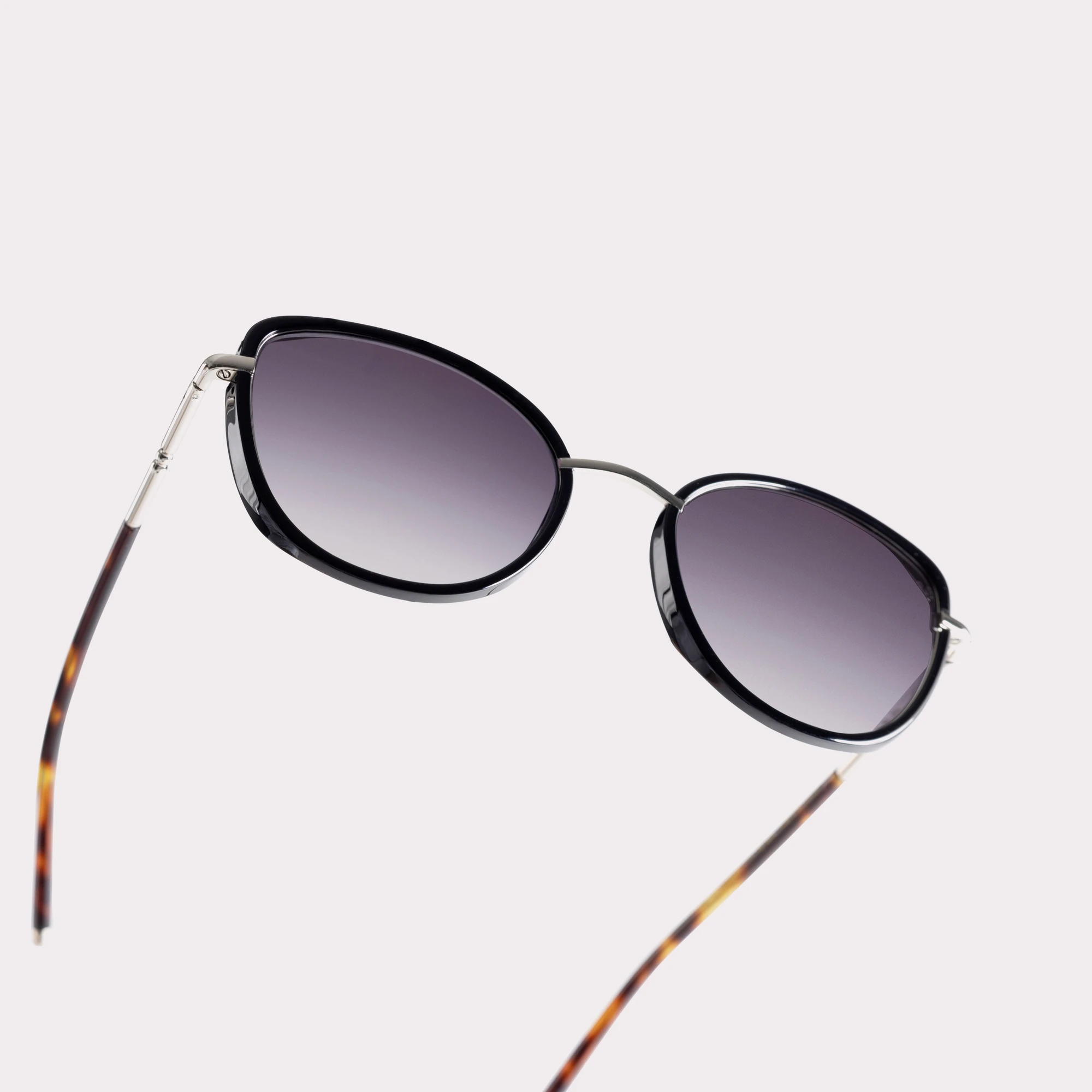 A pair of Indy Black Sunglasses in a macro view