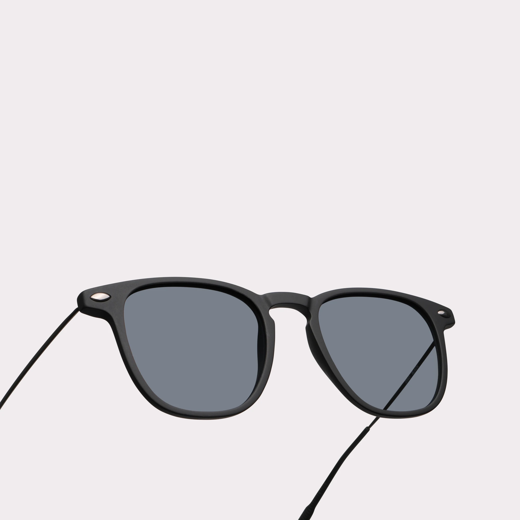 A pair of Doni Black Sunglasses in a macro view