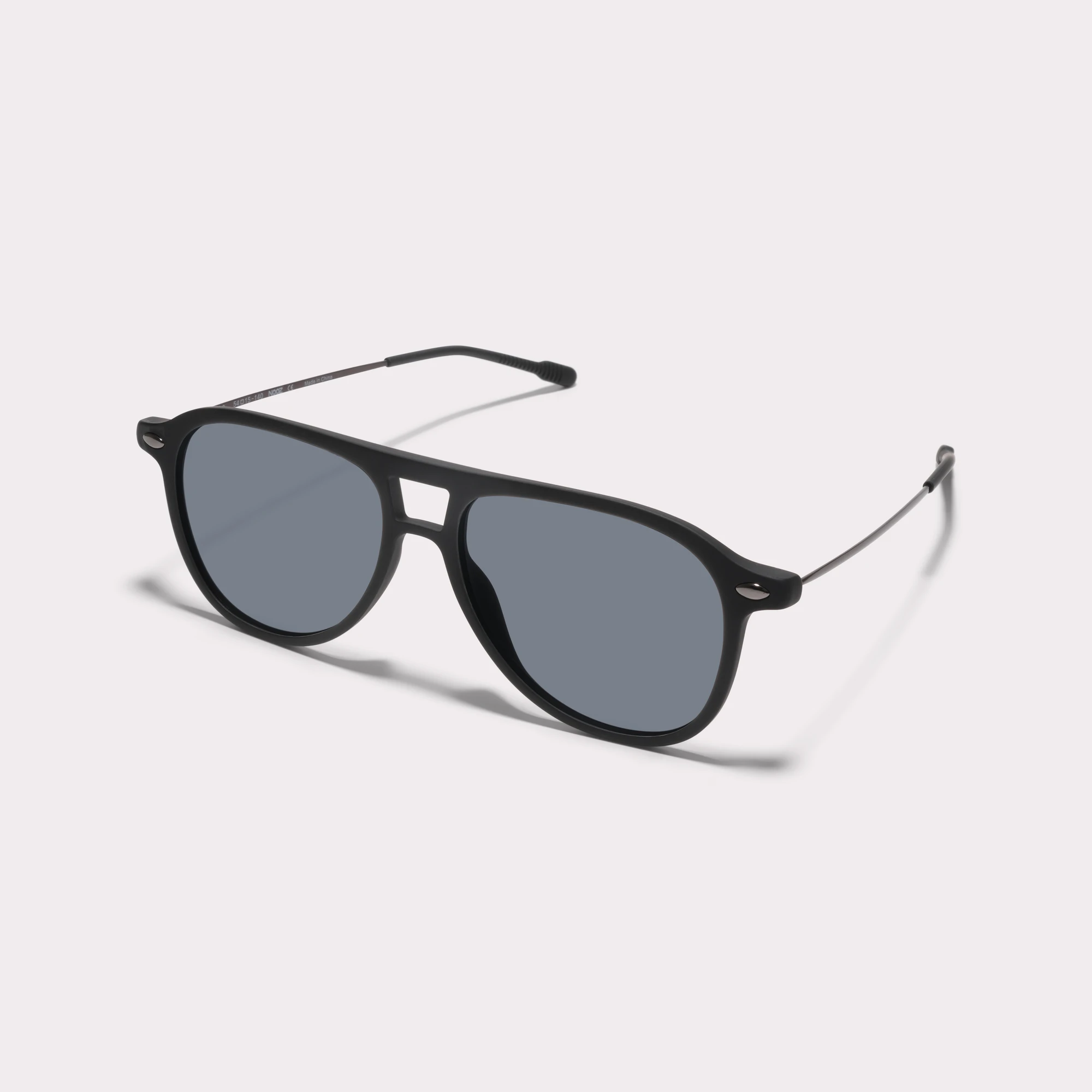 A pair of Fly Black Sunglasses  seen from the side