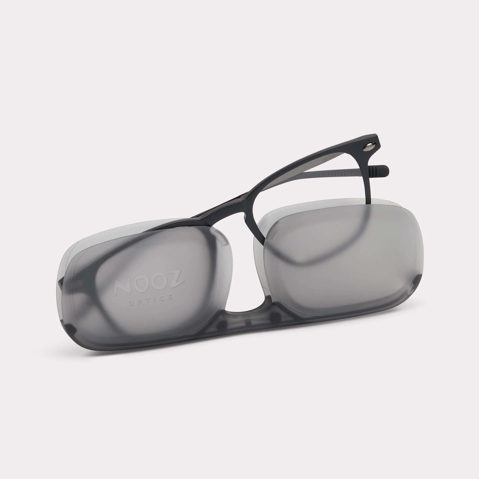 A pair of Doni Black Reading glasses anti-blue light coming out of its case