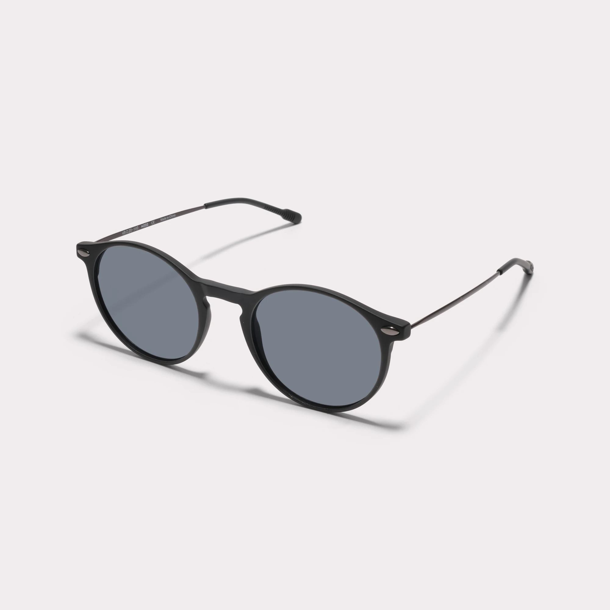 A pair of Cruz Black Sunglasses  seen from the side
