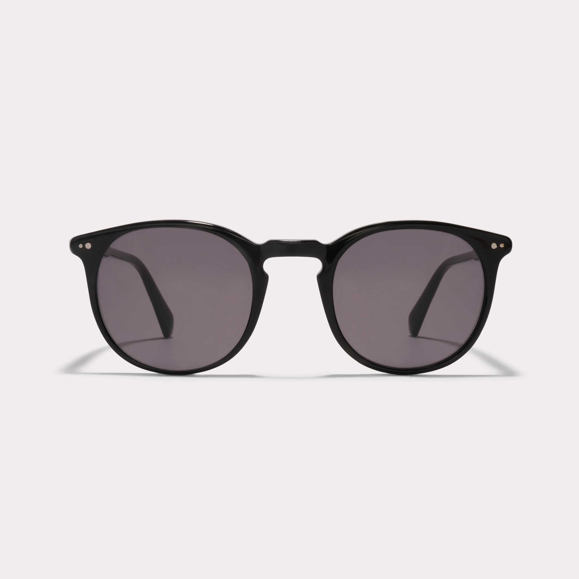 A pair of Basil Black Sunglasses seen from the front