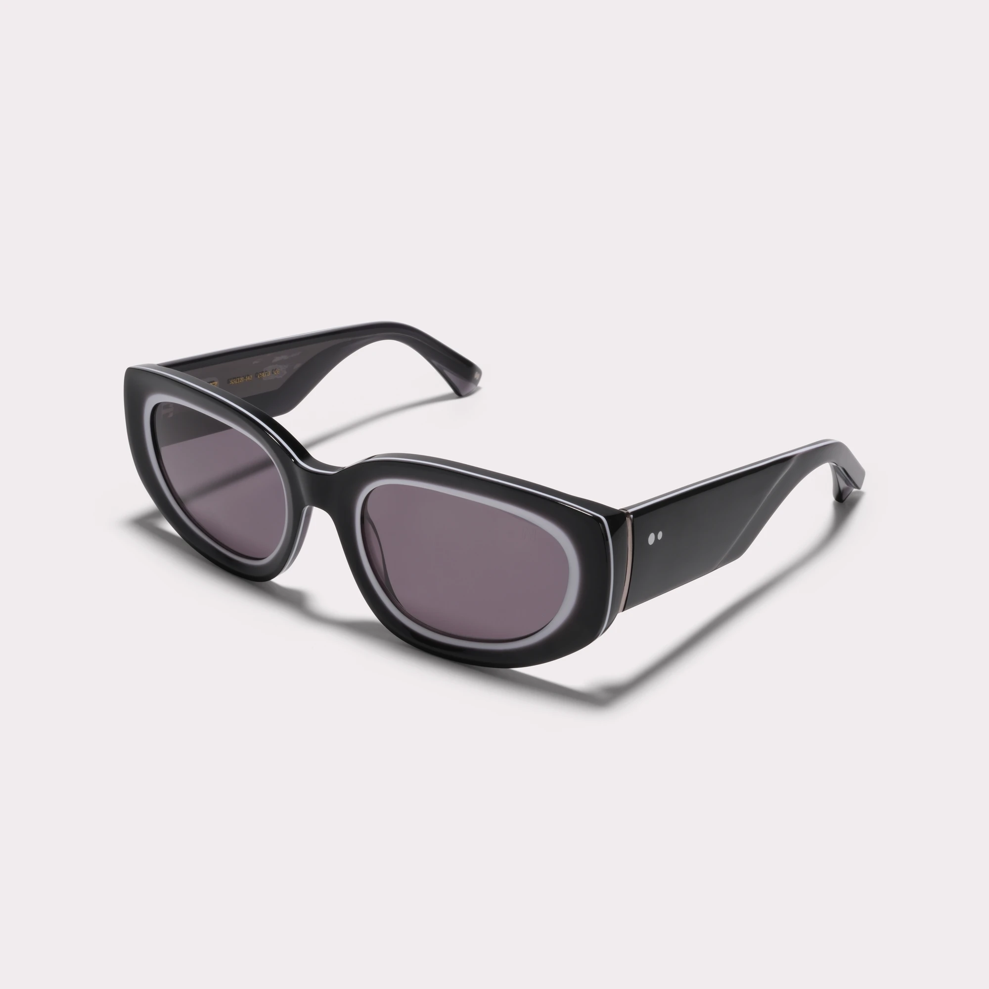 A pair of Lola Black Sunglasses  seen from the side