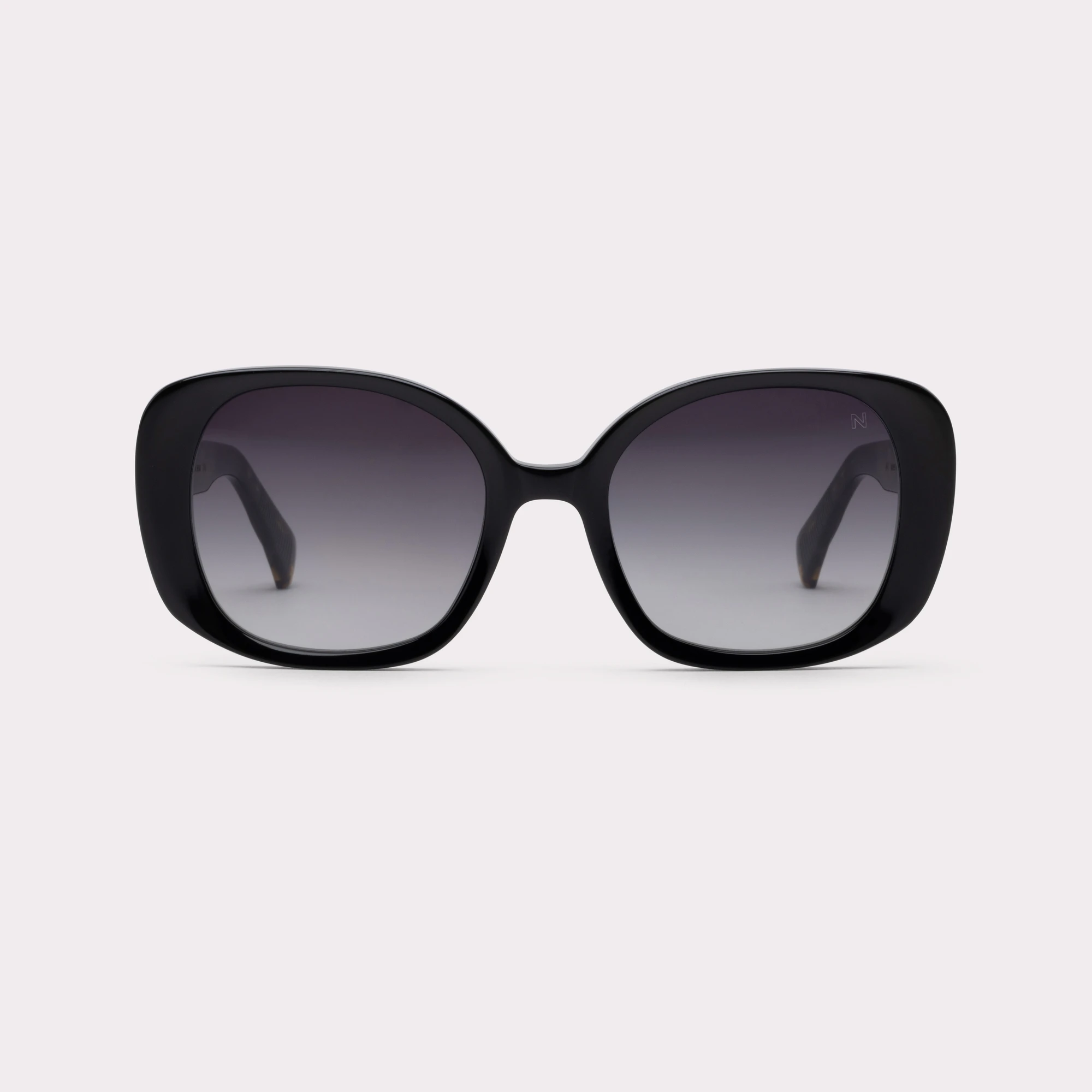 A pair of Joy Black Sunglasses seen from the front