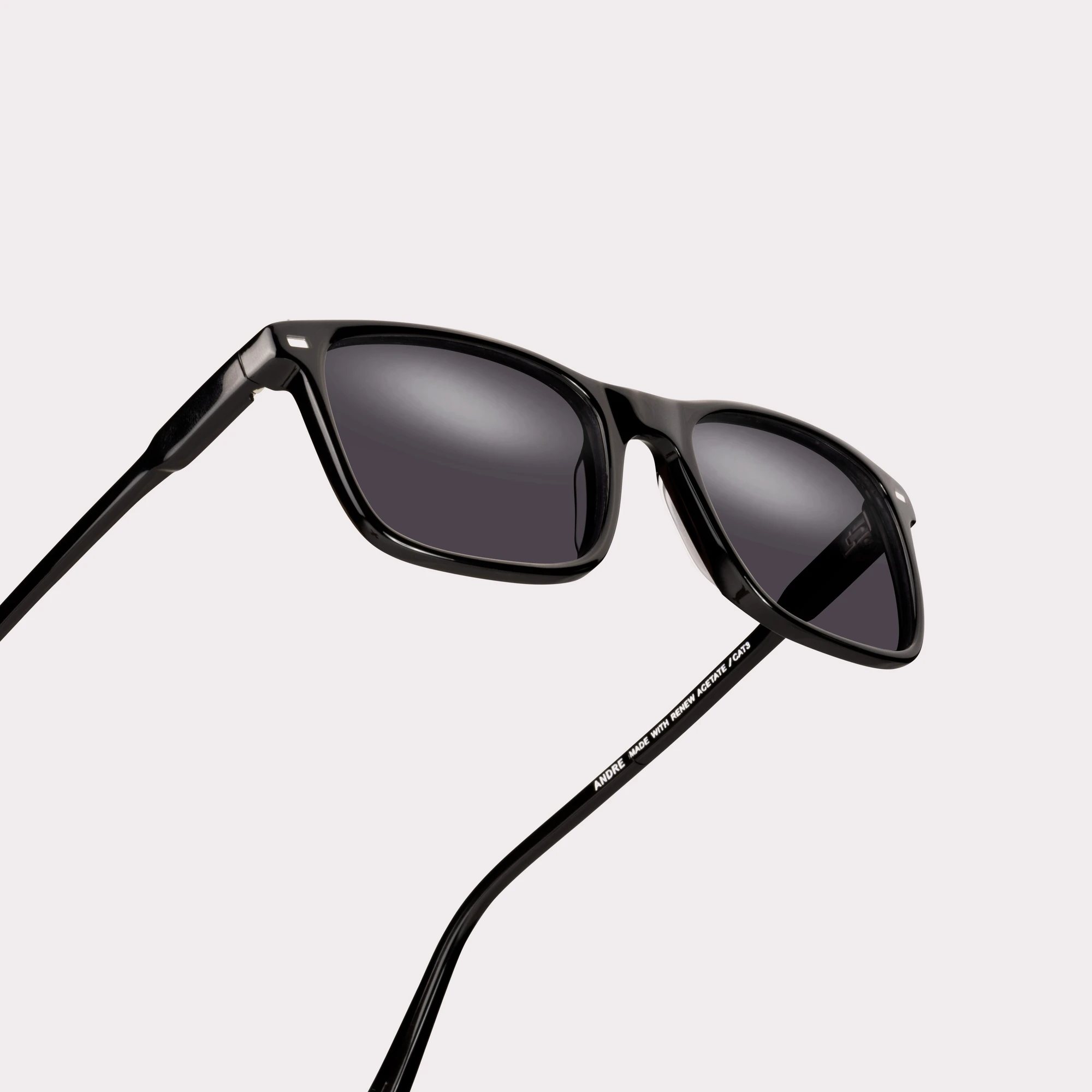 A pair of Andre Black Sunglasses in a macro view