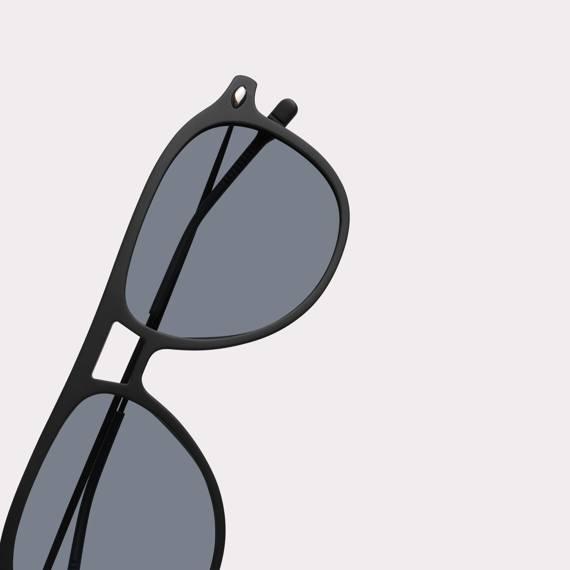 A pair of Fly Black Sunglasses in a macro view