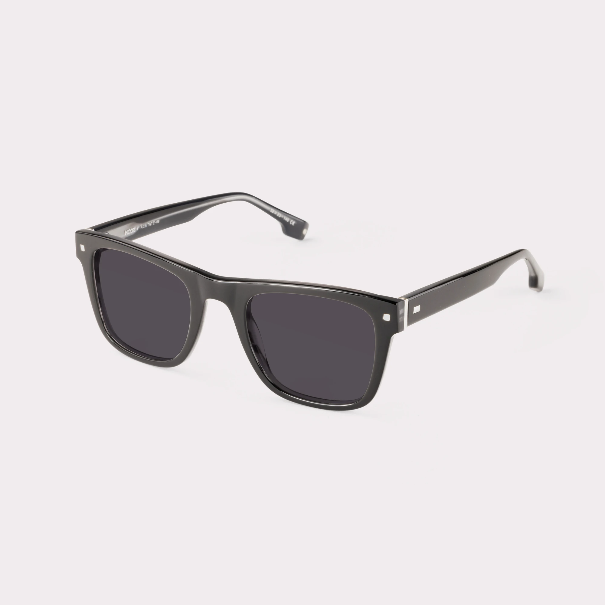 A pair of Casper Black Sunglasses  seen from the side