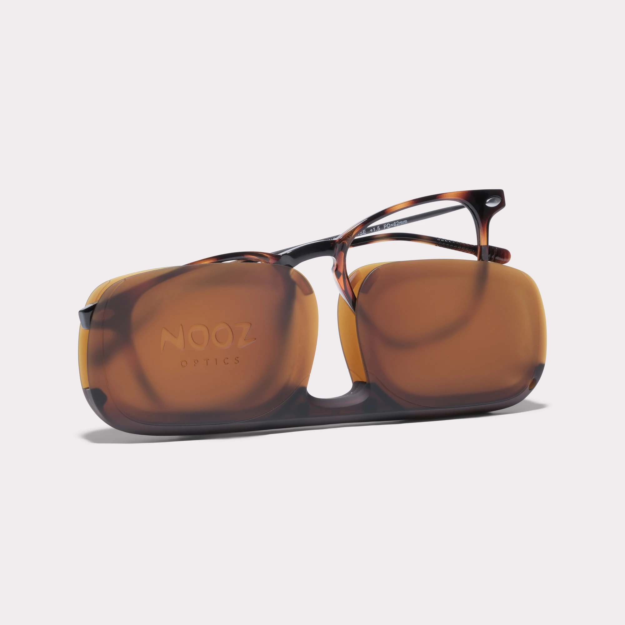 A pair of Doni Tortoise Reading glasses anti-blue light coming out of its case