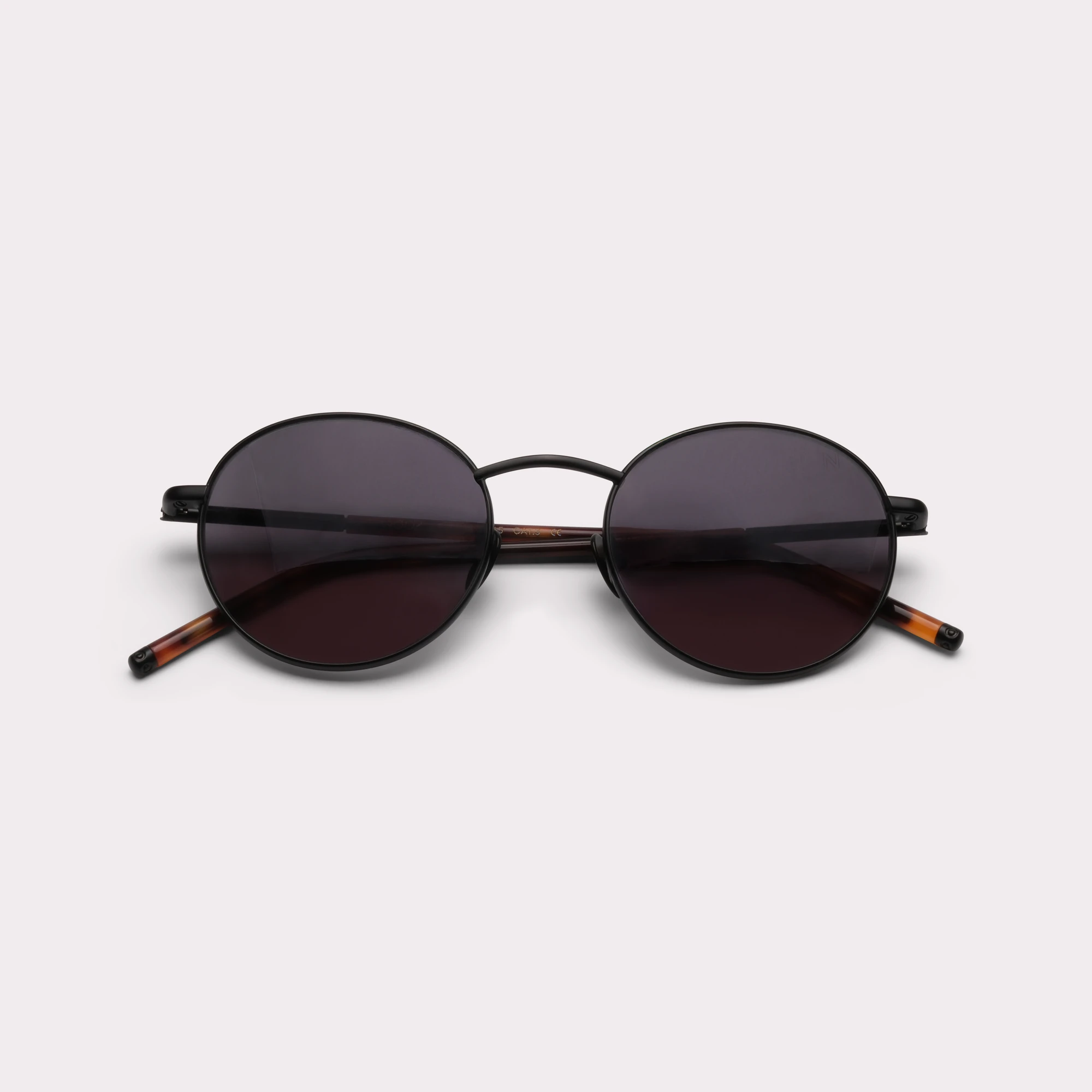 A pair of Ted Black Sunglasses folded