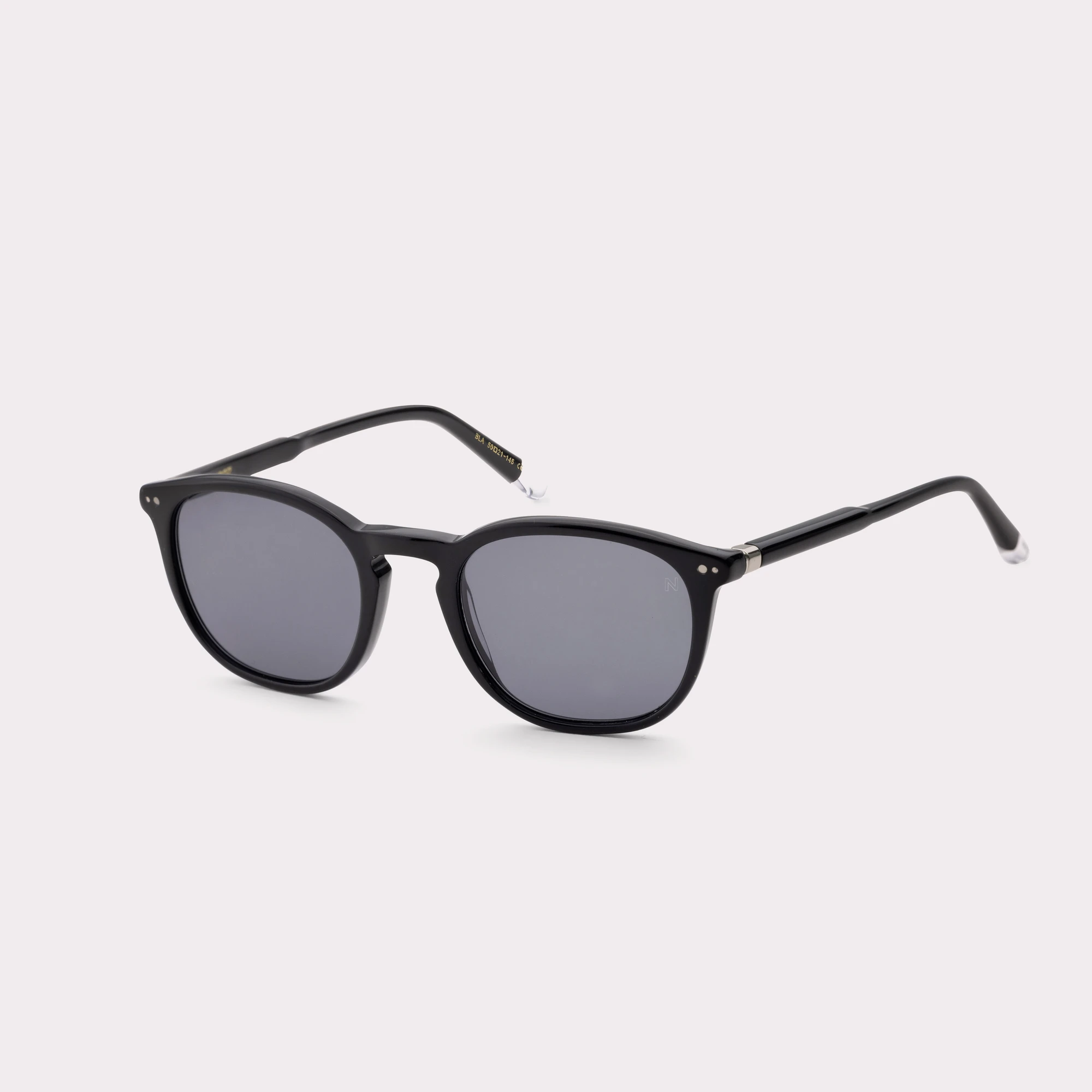 A pair of Roy Black Sunglasses  seen from the side
