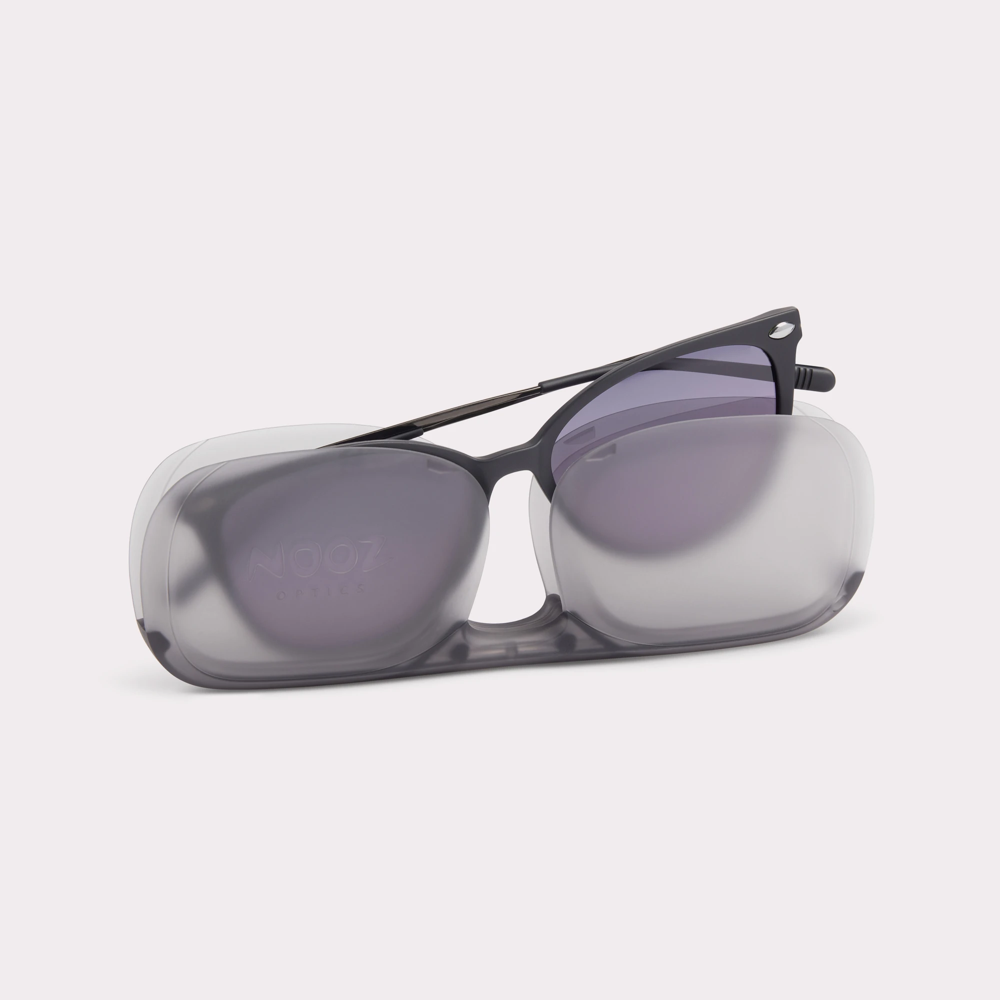 A pair of Ivy Black Sunglasses coming out of its case