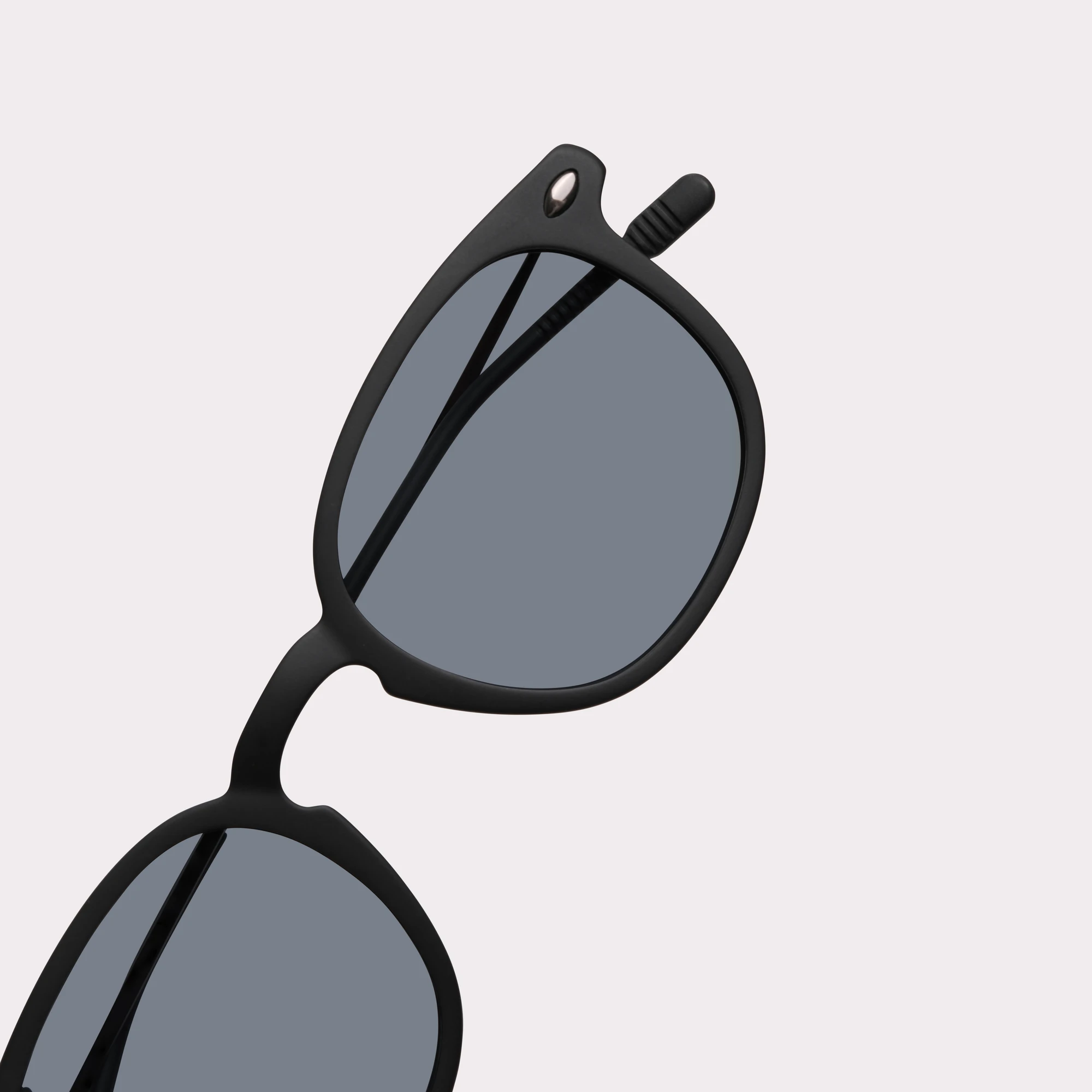 A pair of Alma Black Sunglasses in a macro view