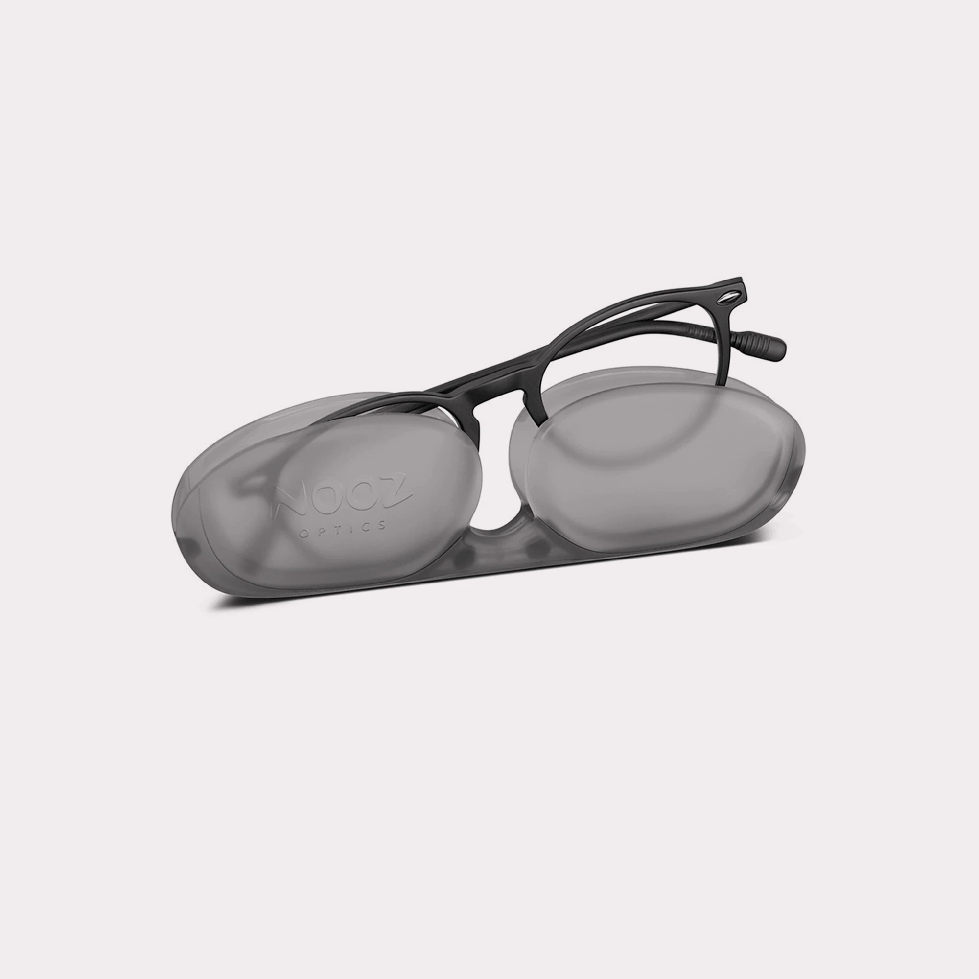 A pair of Cruzy Black Kids' anti-blue light glasses coming out of its case