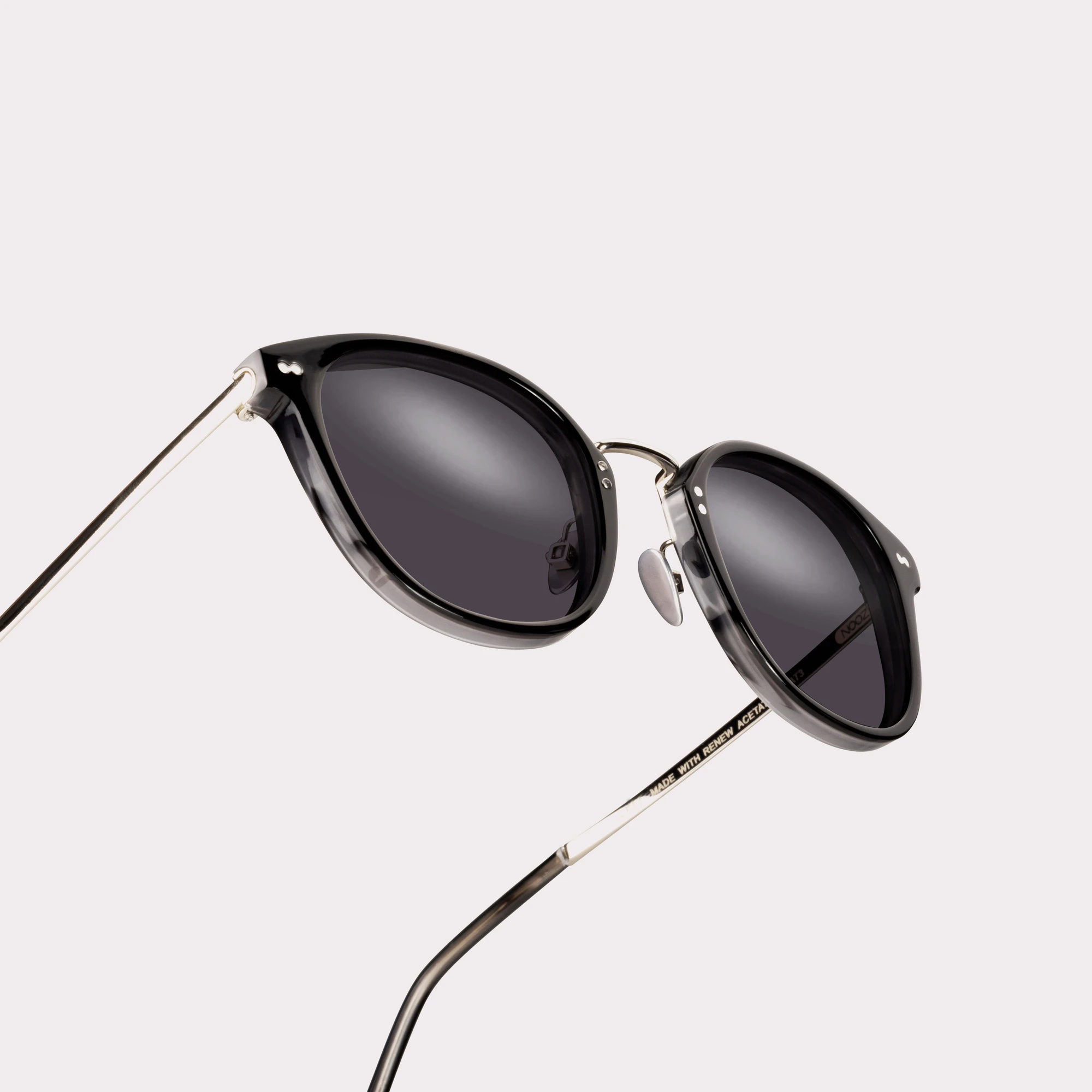 A pair of Covell Black Sunglasses in a macro view