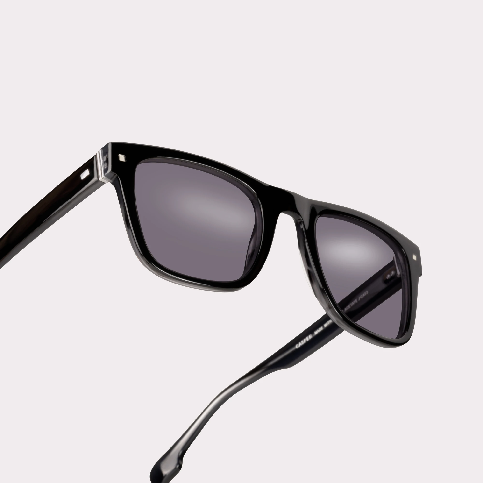 A pair of Casper Black Sunglasses in a macro view