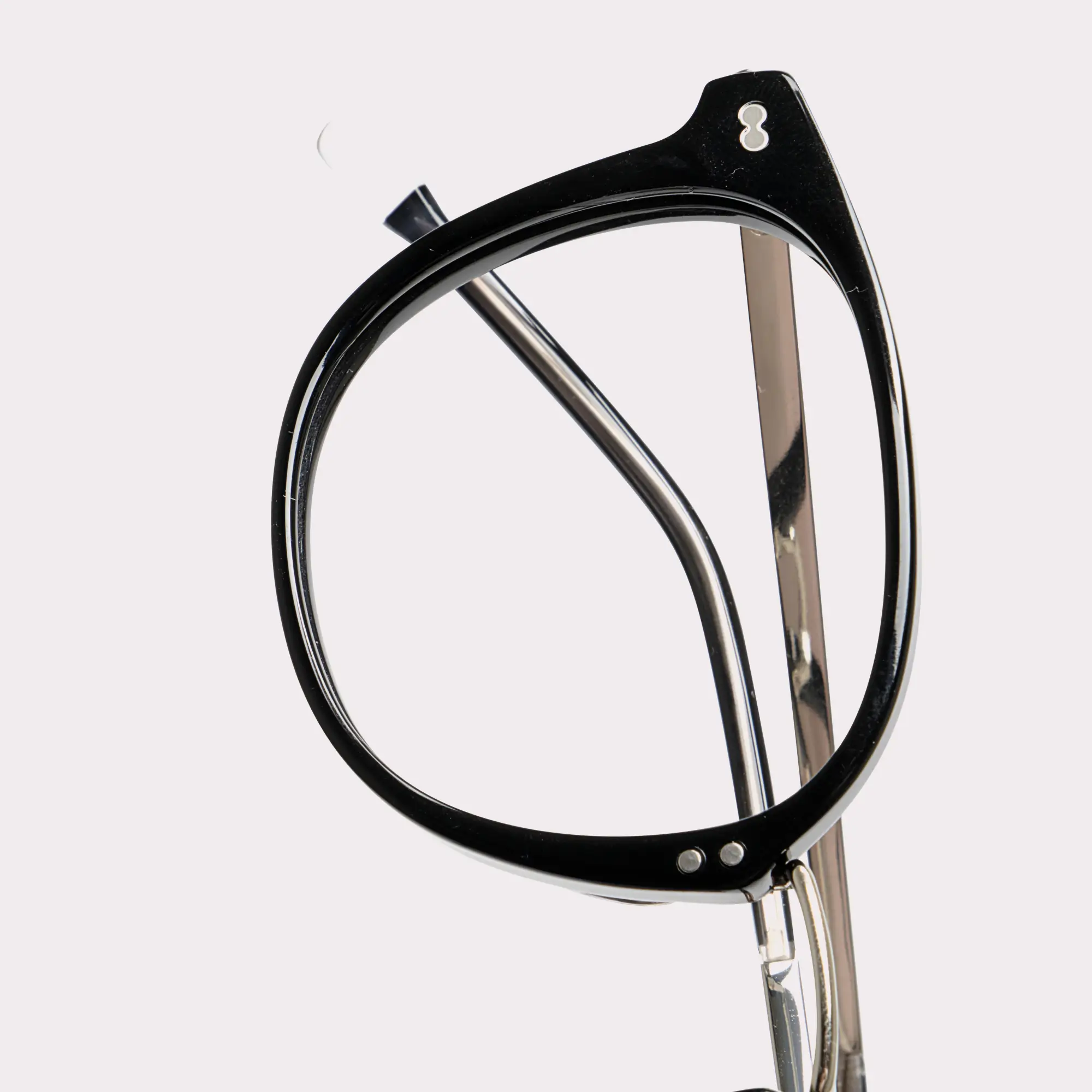 A pair of Covell Black Prescription glasses in a macro view